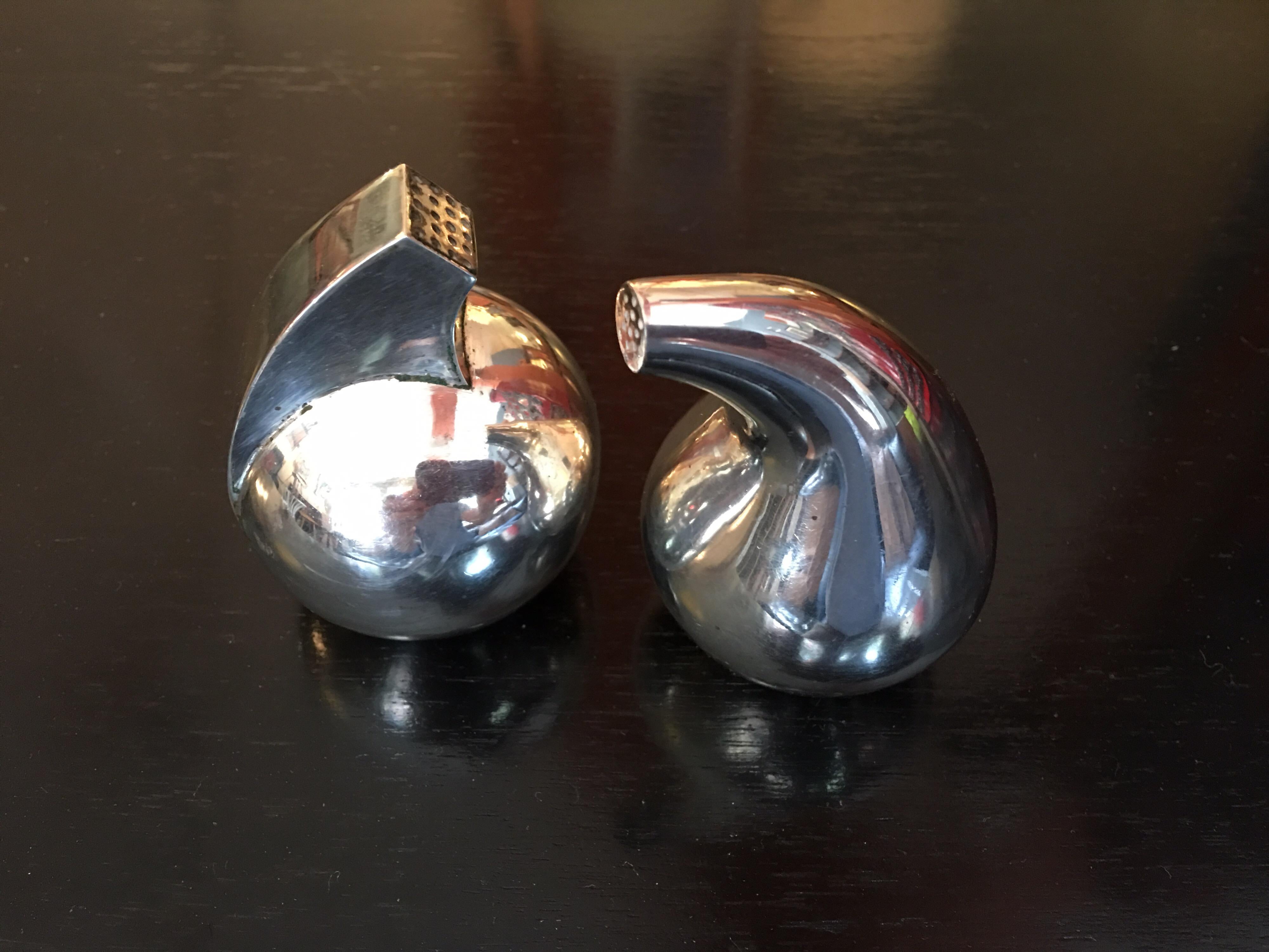 Sculptural salt and pepper by Noted Silversmith Antonio Pineda. Lovely forms, with hallmarks to underside.