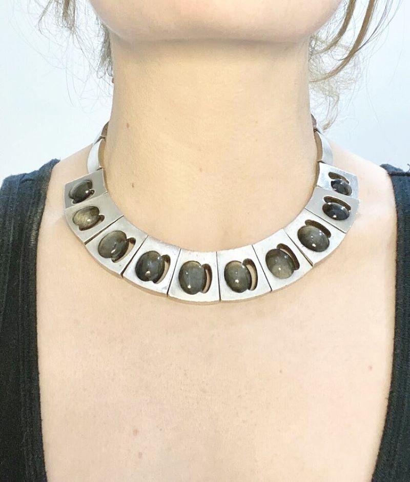 Antonio Pineda Silver and Labradorite Necklace 

Beautifully designed trapezoidal segments each centering oval labradorite cabochons within shadow boxes. 

Modernist Mexican Design 

 Designer: Antonio Pineda 
 Maker: Antonio Pineda 
  Circa: