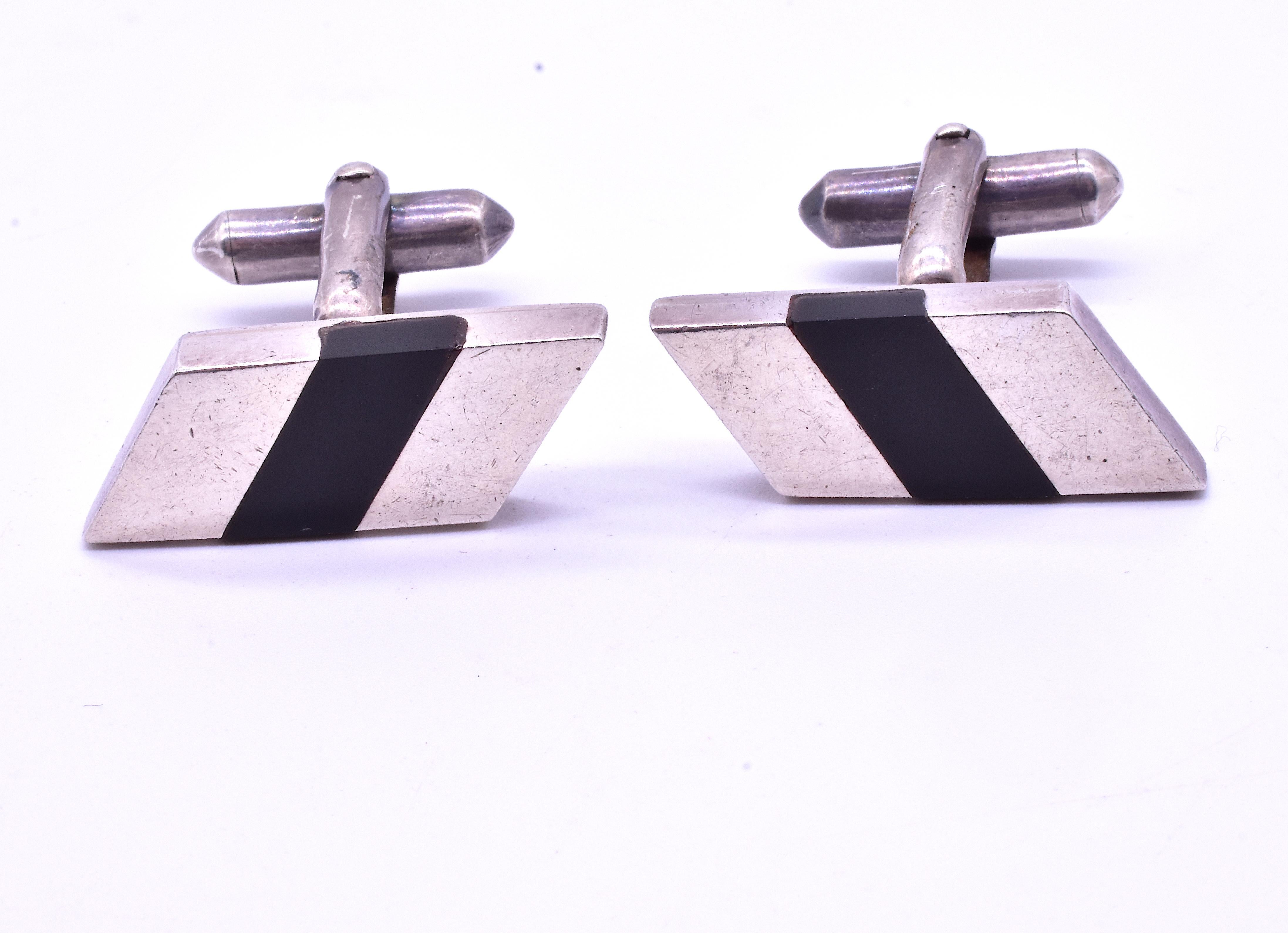 Our avant-garde silver cufflinks were set by hand with onyx and silver and with their classic rectangle on rectangle design, look like they might have been made today, and not 7 decades ago. Perfect for the office or a any occasion, our cufflinks