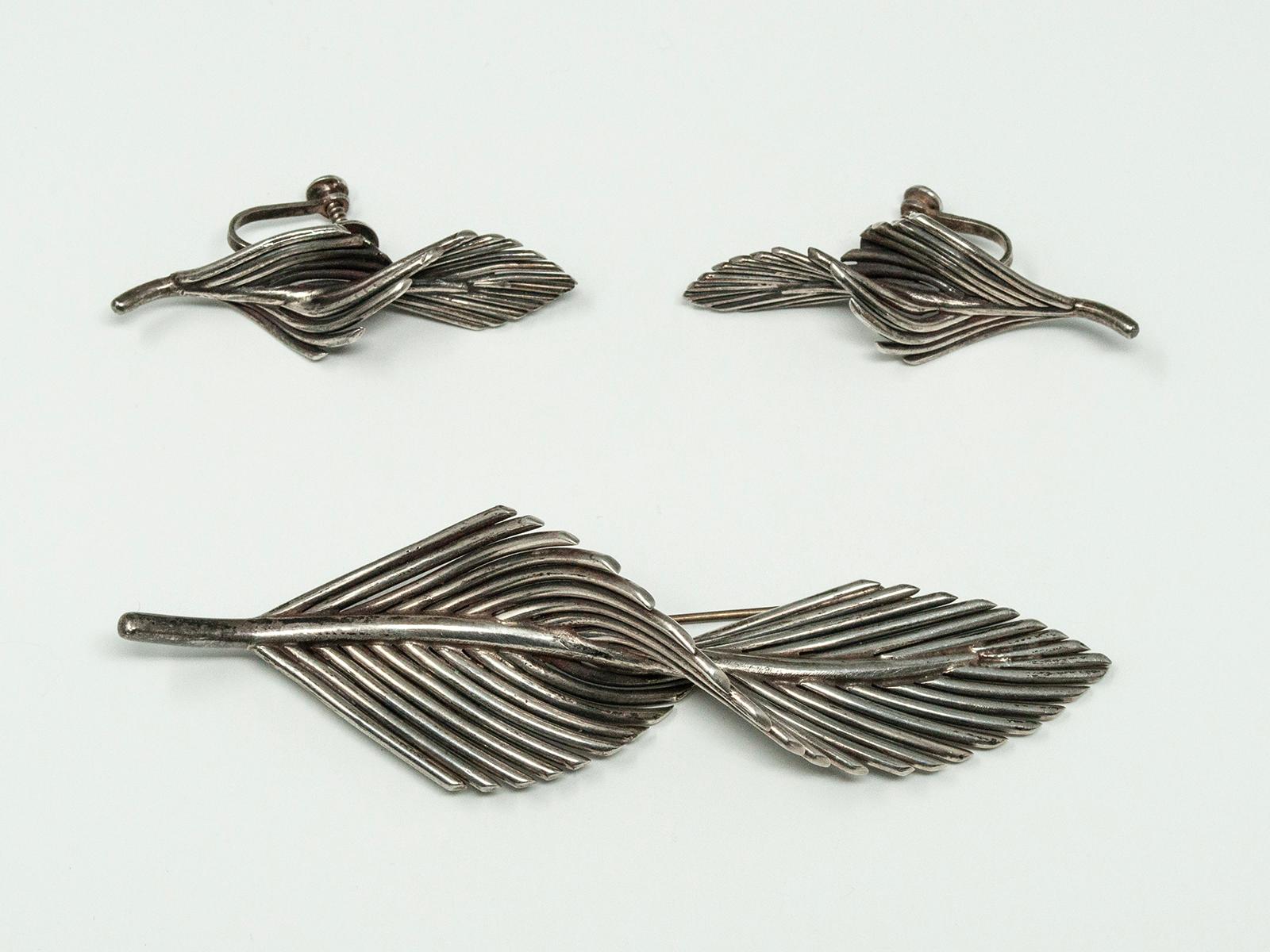 Vintage Antonio Pineda RARE Sterling Silver Mid-Century Modern Brooch. Design references a leaf twisting in the wind. Circa 1930s, this very unique large sterling silver brooch and earrings are signed with Antonio Pineda's signature markings. Made