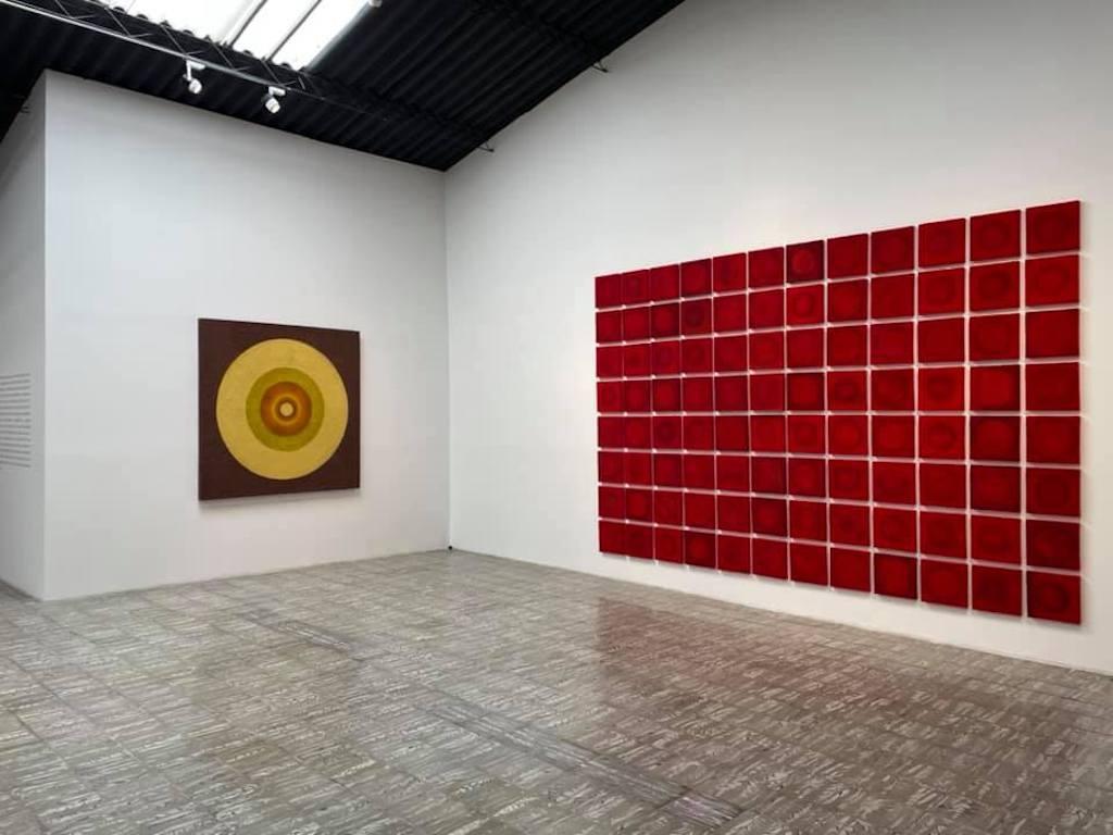 Tantra 48: minimalist abstract spiritual mandala sculpture painting, red circles - Red Abstract Painting by Antonio Puri