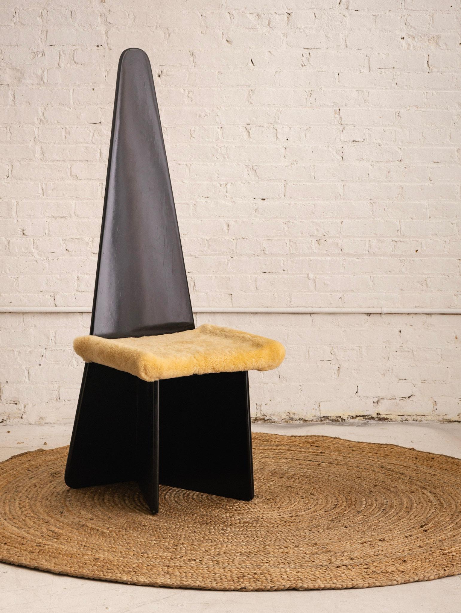 Antonio Ronchetti for Sormani, Italy, black lacquered chair. Pyramid silhouette. Shearling upholstery. Retains original 