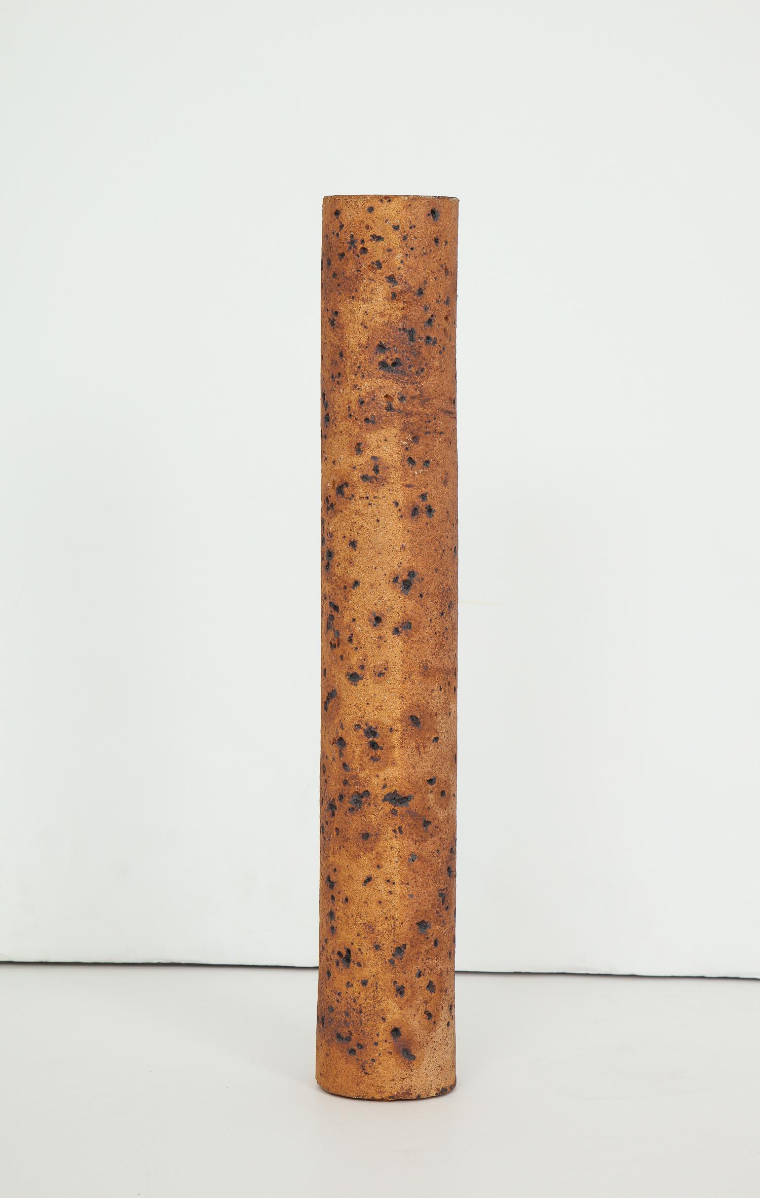 Tall and narrow quasi-natualistic cylindrical vessel with incised stippled patterning by Madrid ceramic artist Antonio Salvador Orodea, principal of the ASO factory. Part of a collection associated with the 1964-1965 Wold’s Fair in Flushing Meadows,