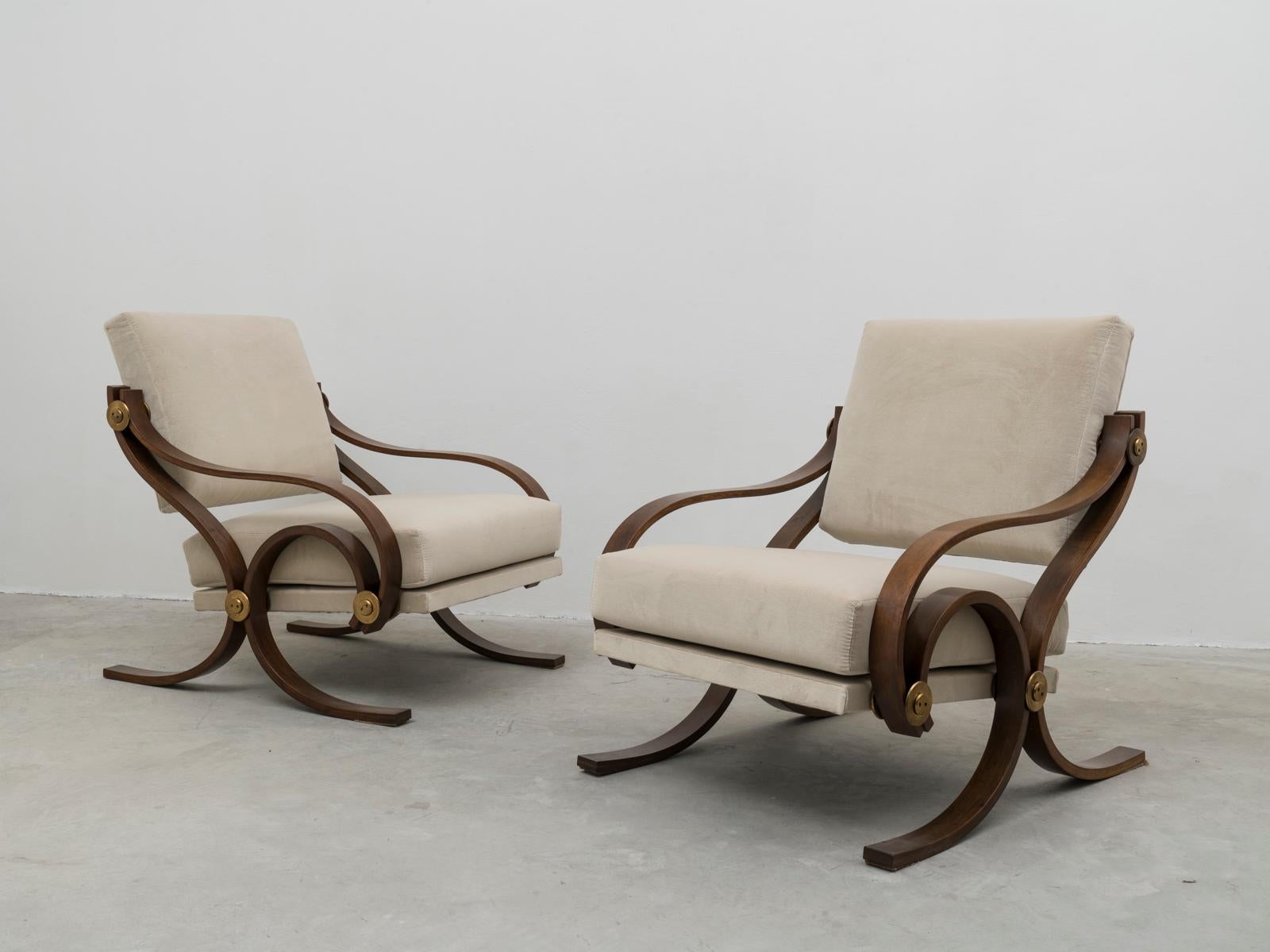 This very rare pair of midcentury armchairs was designed by Antonio Scoccimarro, son of the important architect Cesare, for Adrasteia in the late 1950s. The model is called 