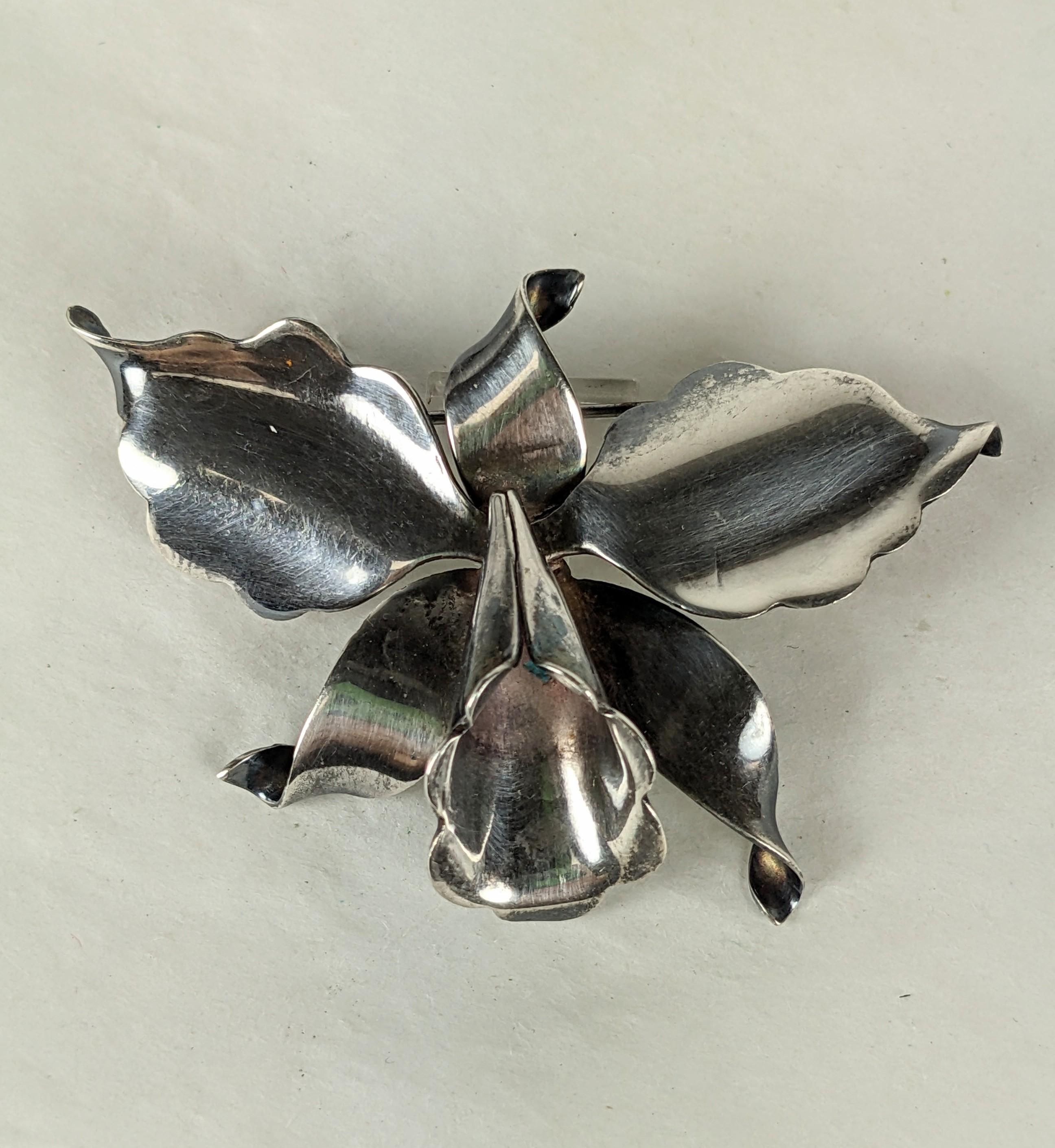 Lovely Antonio Sterling Orchid Brooch from the 1940's. Hand made in sterling sheet metal with early hallmark. 940 standard silver (higher than sterling). 1940's Mexico. 2.5