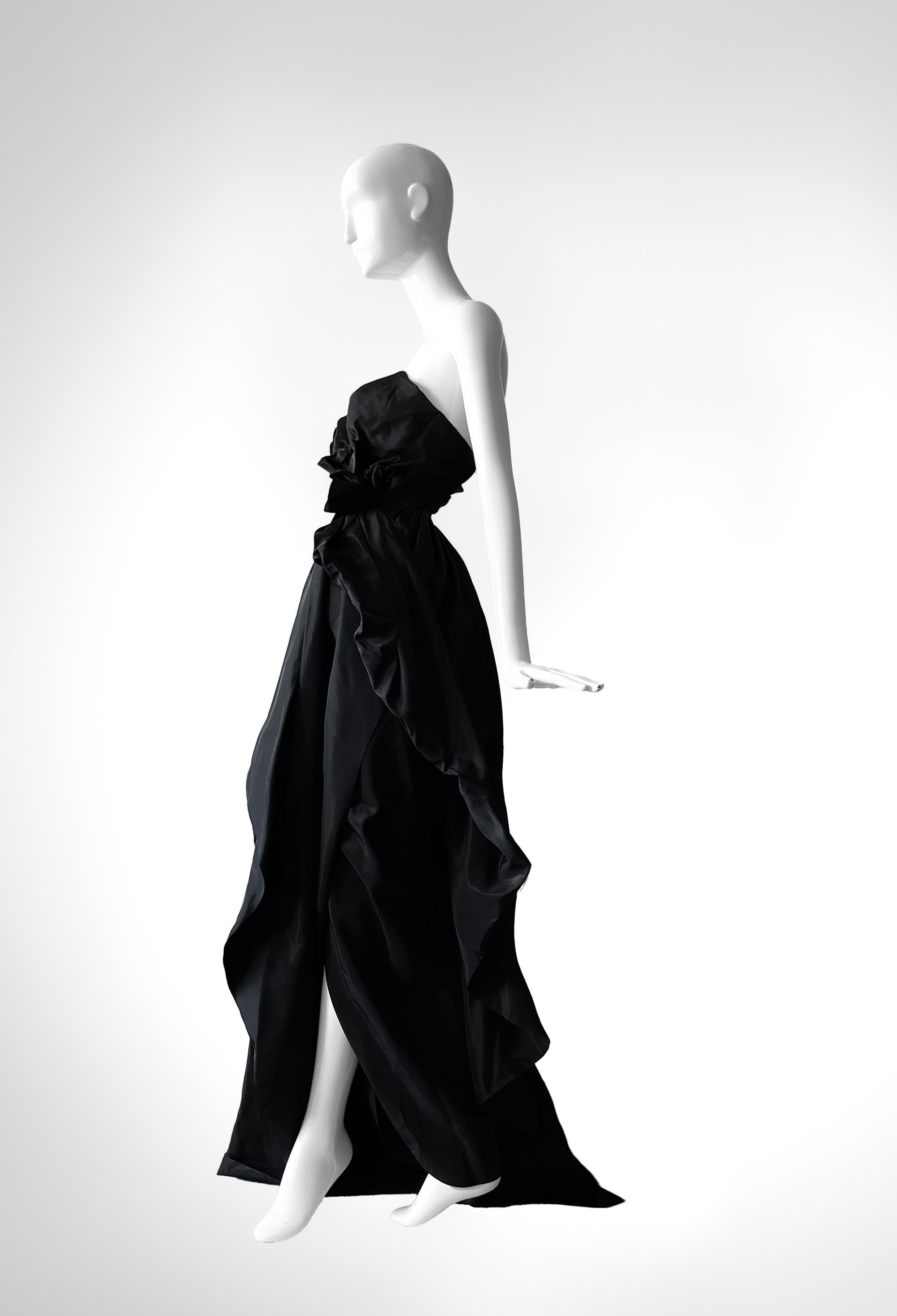 Sumptuously sculpted and unapologetically dramatic, this 1990s Antony Price evening gown speaks volumes about the era’s fascination with high-octane Glamour. Price - famous for his impeccably structured silhouettes - infuses this piece with a sense