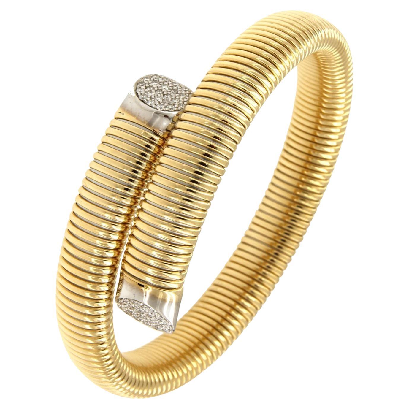 Flexible and adaptable bracelet with tubogas craftmanship that 
fits wrists of 7,87 inches medium to large
Available in three colours of gold, yellow, white and rose.
Gold weight  32,9GR and 0.33Carat Diamonds
Video is of similar bracelet so you can