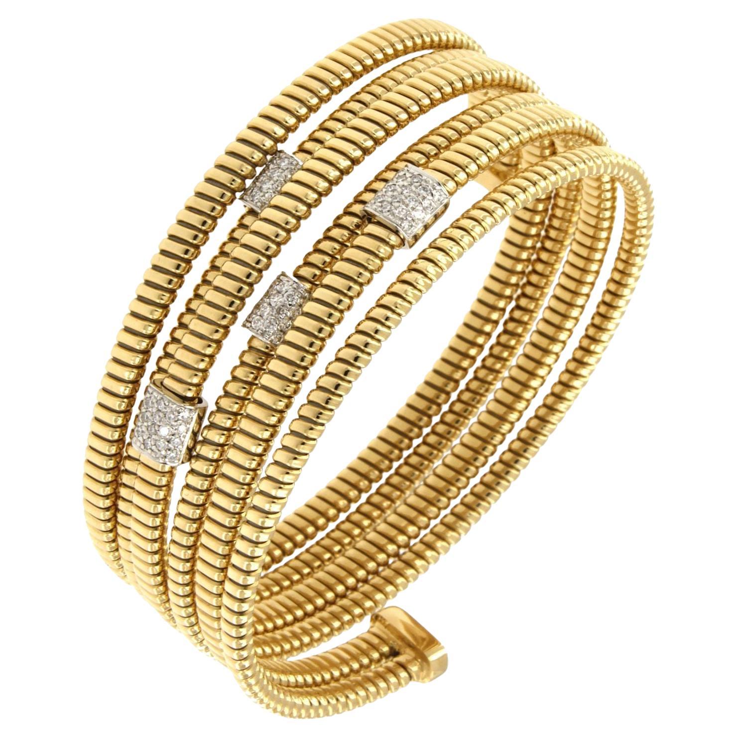 Flexible and adaptable bracelet with tubogas craftmanship that 
fits wrists of 7,87 inches medium to large
Available in three colours of gold, yellow, white and rose.
Gold weight  18,8GR and 0.33Carat Diamonds
Video is of similar bracelet so you can