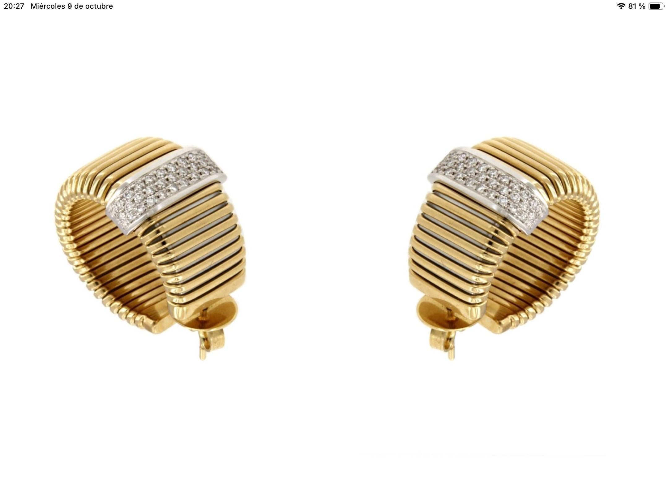 Pendientes Antora Tubogas de oro amarillo de 18k y pavé de diamantes 0,65 ct

Peso 15,20 gramos

Disponible en tres colores de oro, amarillo, blanco y rosa. Este listado es aplicable al  amarillo  opción. 


Solicitar disponibilidad si está en stock