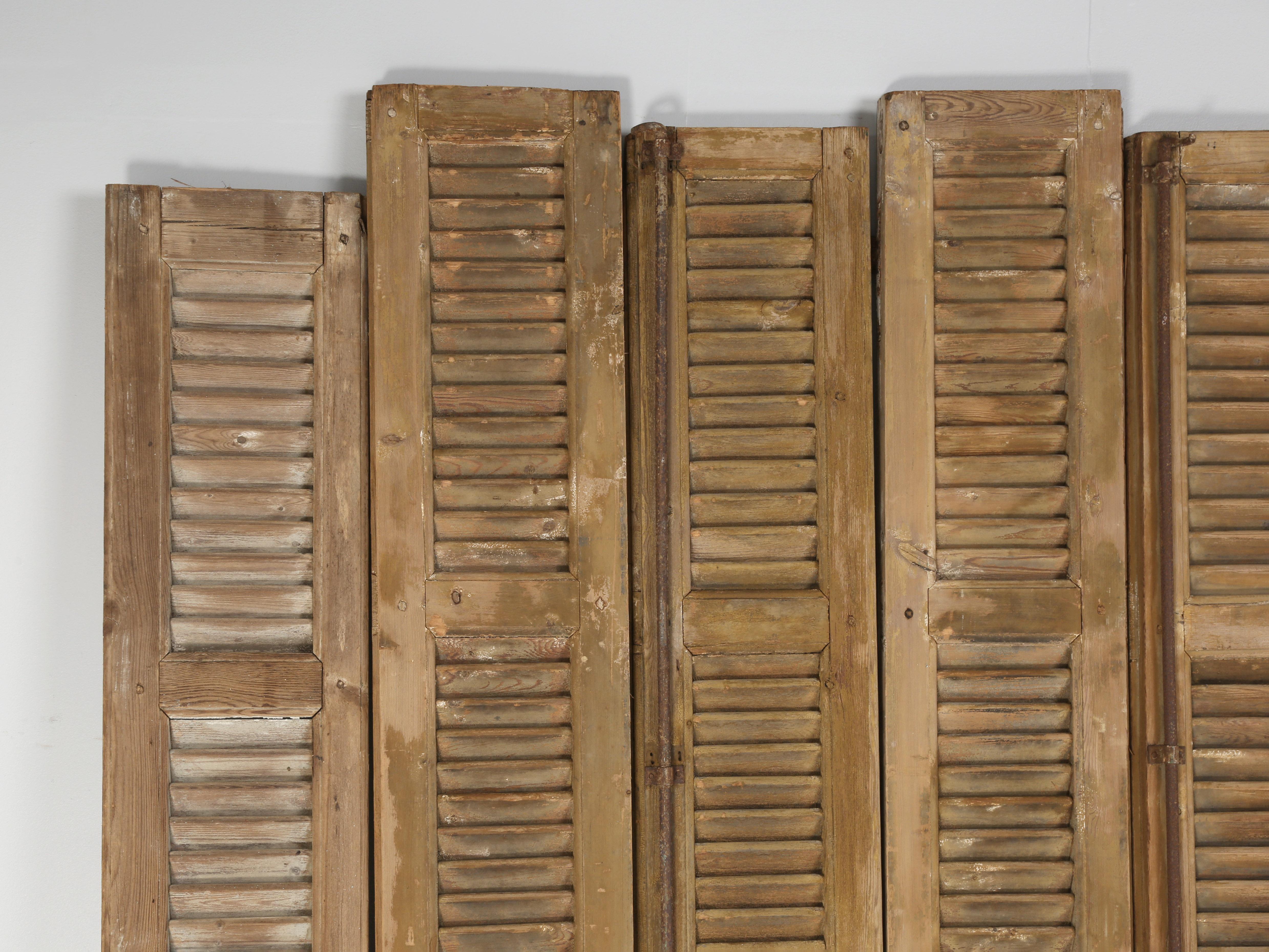 Antique French shutters that were removed from a chateau in Brittany decades ago and placed in storage. They are in fair to rough condition and are priced accordingly, however they would make a great screen or headboard. 
**Height provided is for