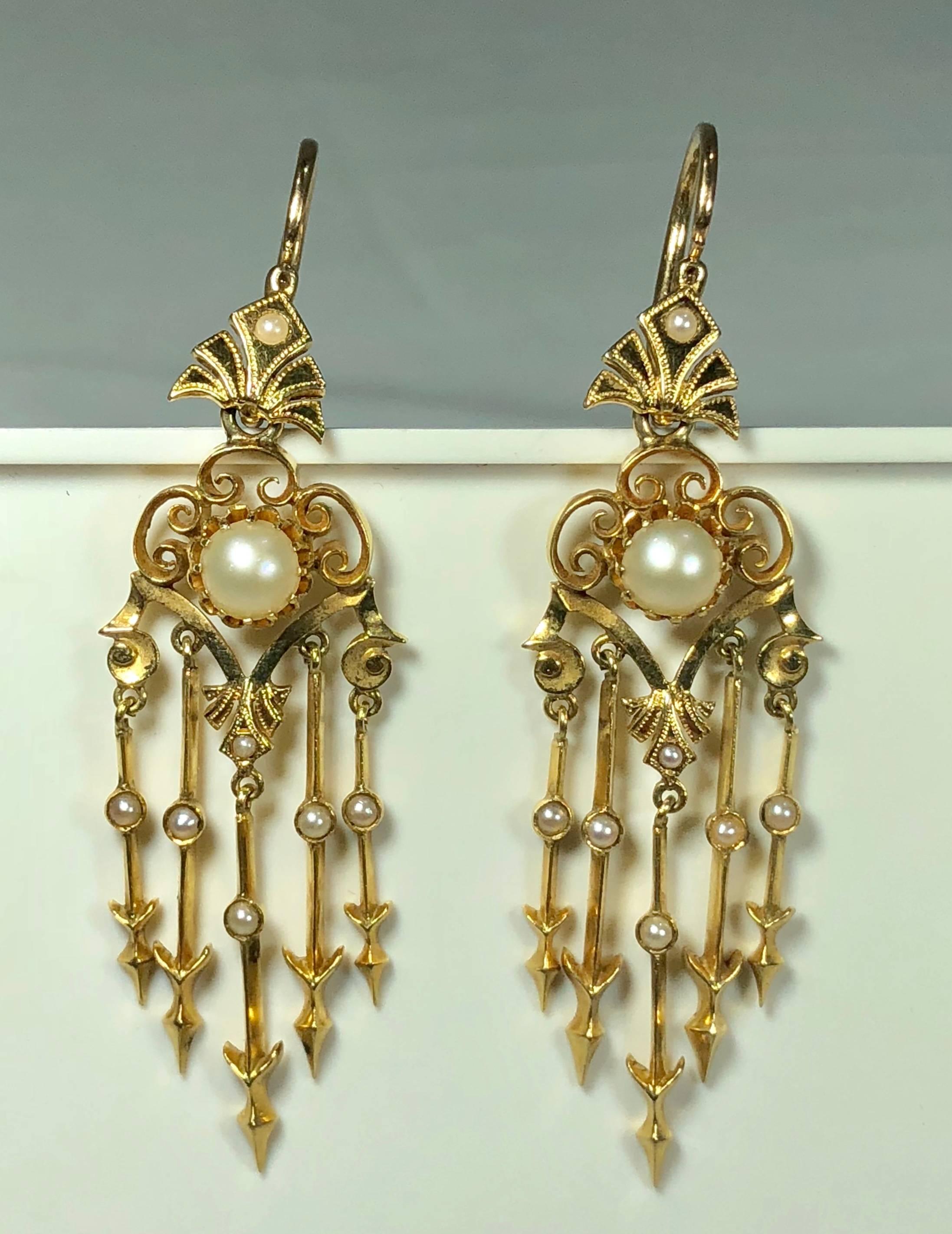 Antique Victorian 18 karat natural pearl and seed pearl chandelier earrings. These stunning Victorian true antique earrings are created in 18 karat (tests 18 Karat), yellow gold. The rich yellow orange bright gold has such a beautiful patina, the