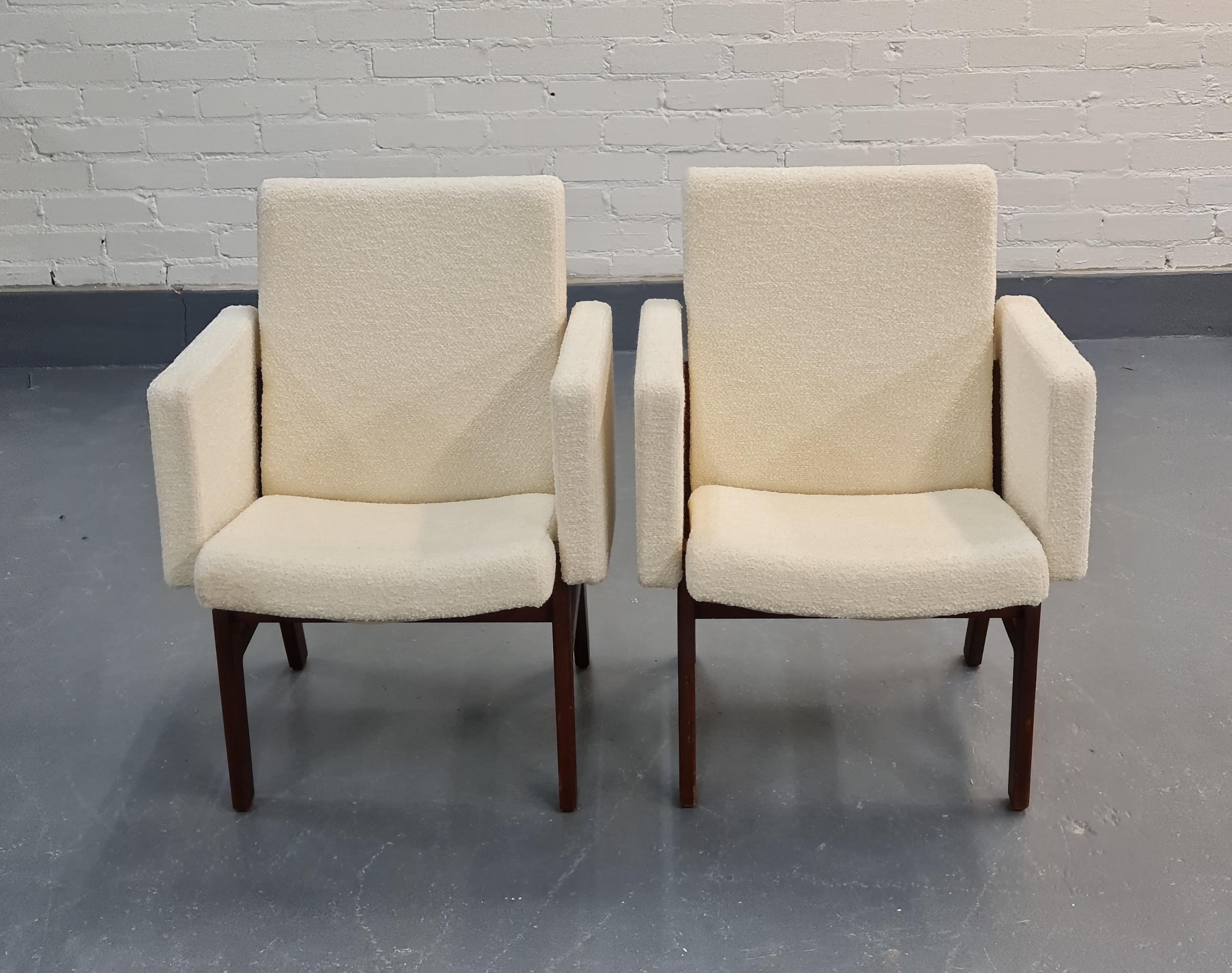 A pair of compact and pragmatic armchairs designed by Antti Nurmesniemi, and reupholstered in beautiful white wool fabric. Both chairs have sustained a great condition although they are from as far back as the 1950s. The chairs were originally in