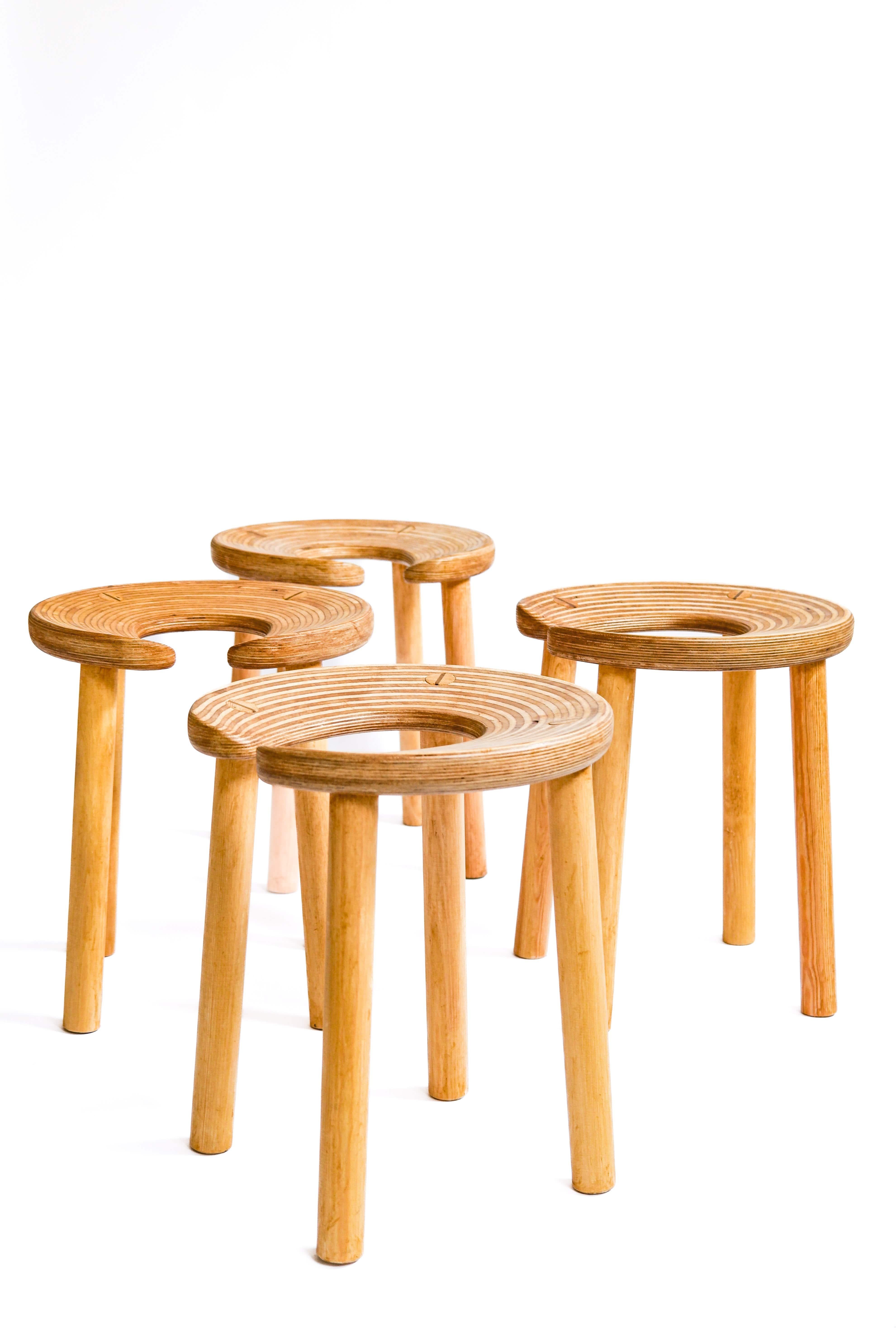 Really nice set of the famous Horseshoe Sauna Stool Designed in 1952 for the interior of the Palace Hotel in Helsinki. This set has been produced in the late 80's in Laminated-birch plywood, teak, stained birch. Each: 43.7 x 37.9 x 36 cm.