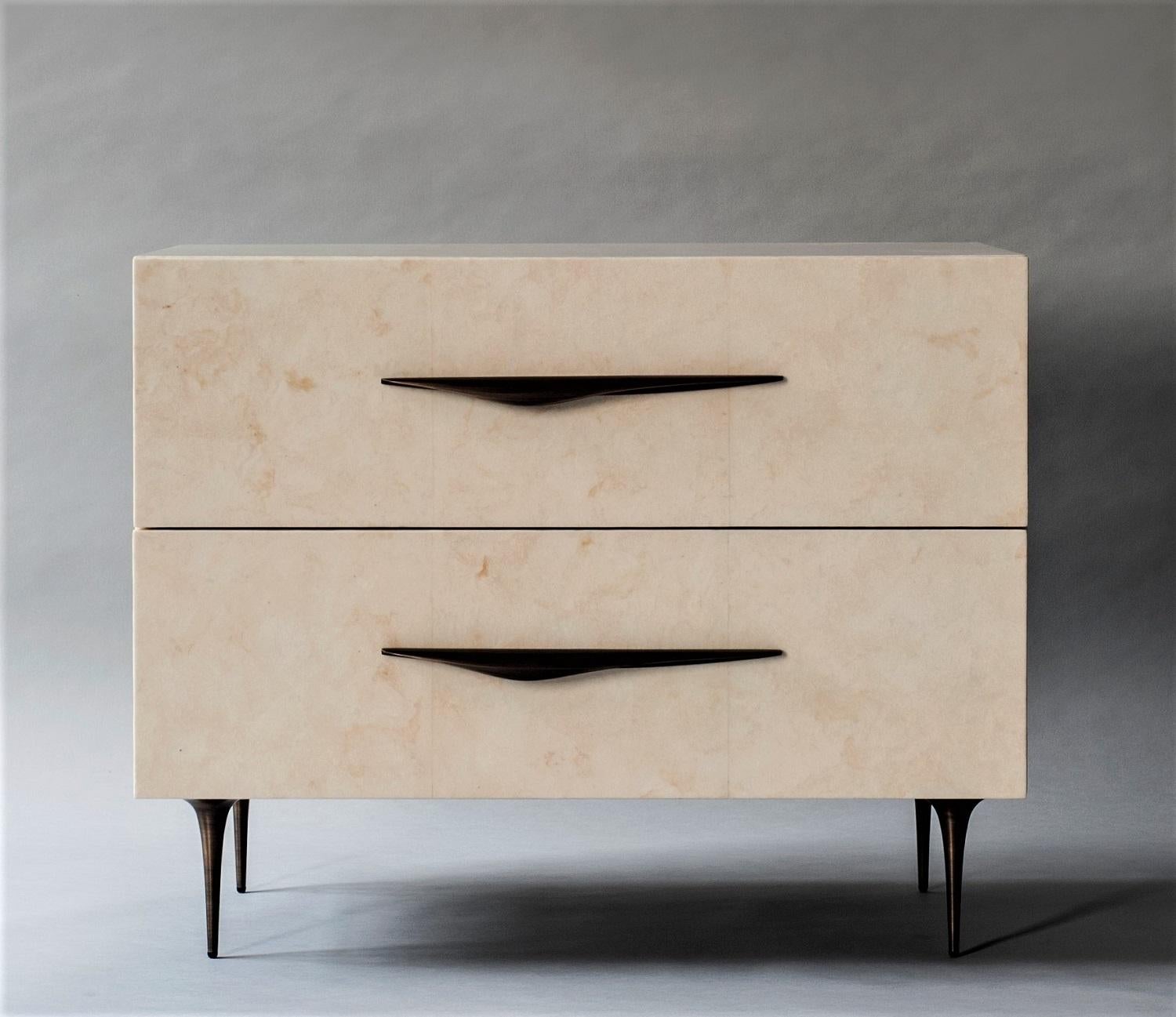 Antwerp bedside table by DeMuro Das 
Dimensions: W 76.2 x D 47.1 x H 61 cm
Materials: Carta (Ivory) - Matte 
 Solid bronze (Antique) handles and legs

Dimensions and finishes can be customized 

DeMuro Das is an international design firm and the