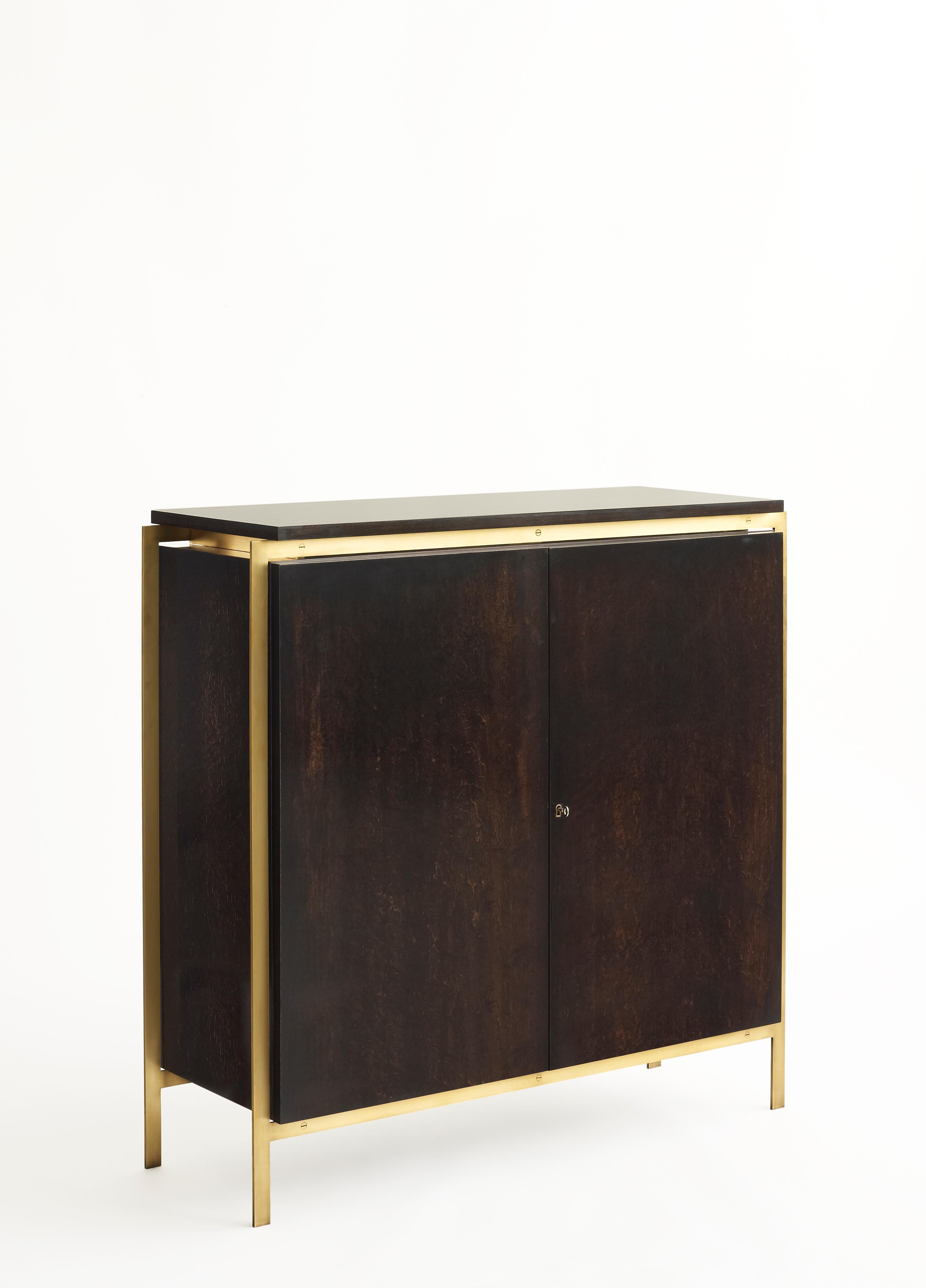 Measurements
38 W x 14 D x 37.5 H inches

Material Specifications
Frame: Blackened oak, walnut, bleached oak, or white lacquer
Metal: Brushed brass, blackened brass, bronze, brushed nickel

Notes
Finishes and dimensions may be customized.