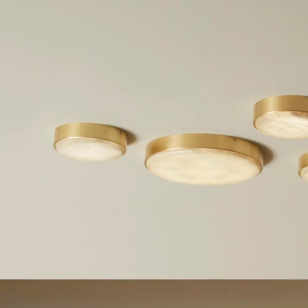 Anvers small wall/ceiling lamp by CTO Lighting
Materials: satin brass with alabaster stone
Also available in bronze with alabaster stone
Dimensions: H 4.8 x W 19.5 cm 

All our lamps can be wired according to each country. If sold to the USA it will