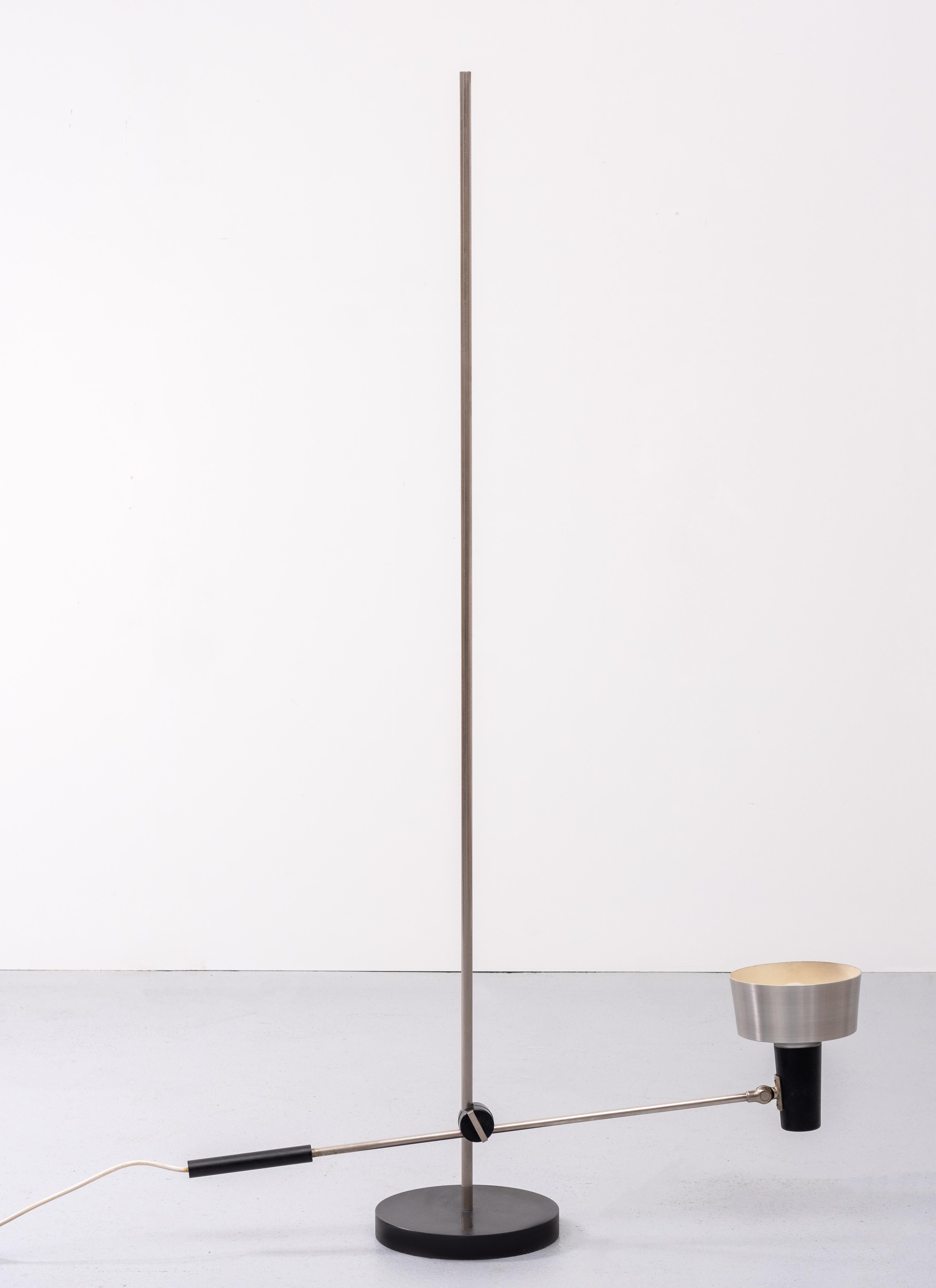 Adjustable Anvia floor lamp designed by J. Hoogervorst in ca.1960. This aluminum lamp is fully adjustable and suitable for direct light to read or indirect light on the wall or ceiling. Considering its age this vintage floor lamp is in good and