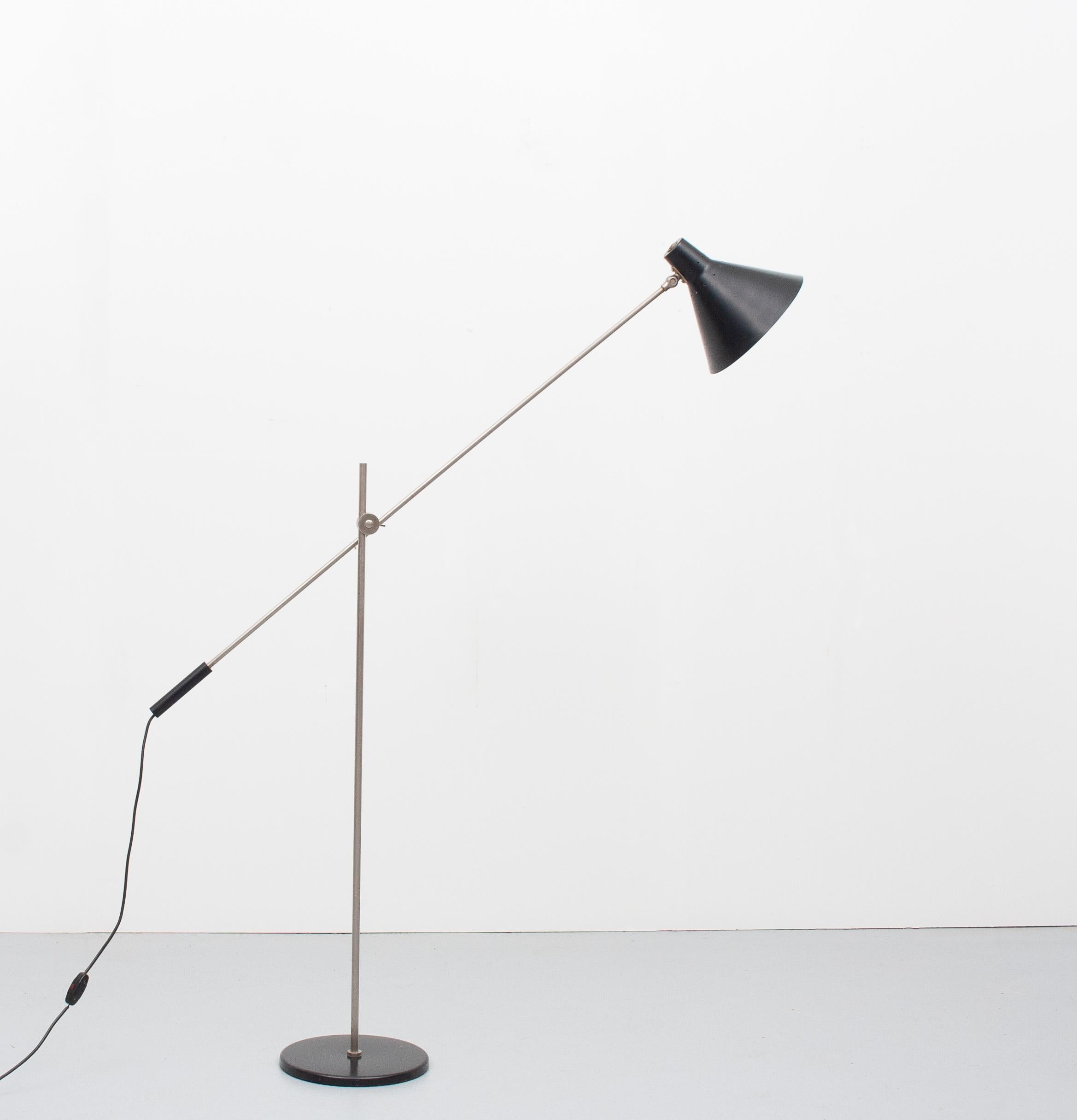 Very nice sleek mid century floor lamp. Adjustable in height and direction. Black perforated shade.
Nickel upright. Black heavy base. Very good condition. With normal user marks.