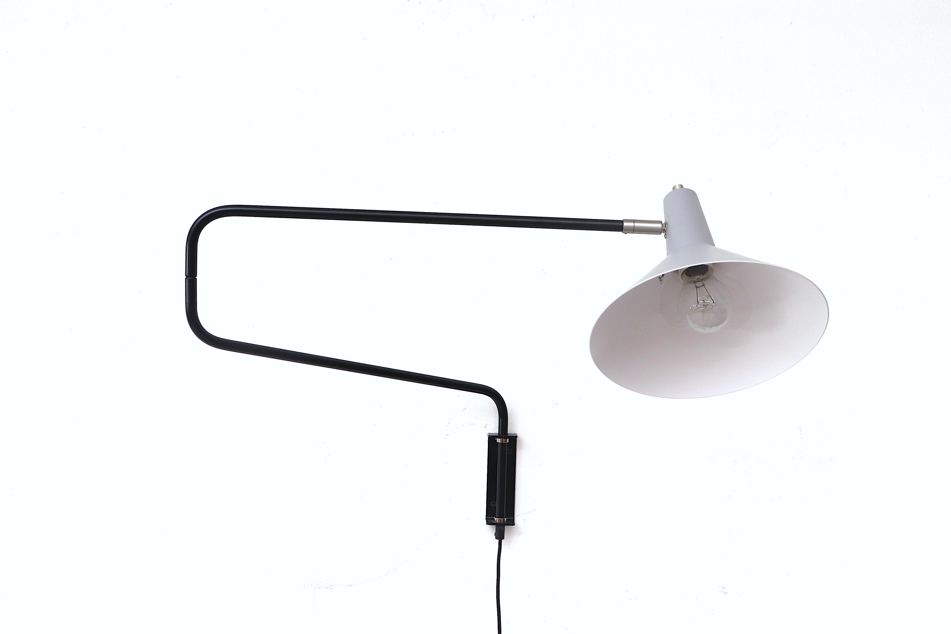 Newly re-issued Anvia 'The Paper Clip' wall lamp with grey shade and black arm. The paper clip style arm swings to extend or retract for versatile use and tilting/rotating shade.