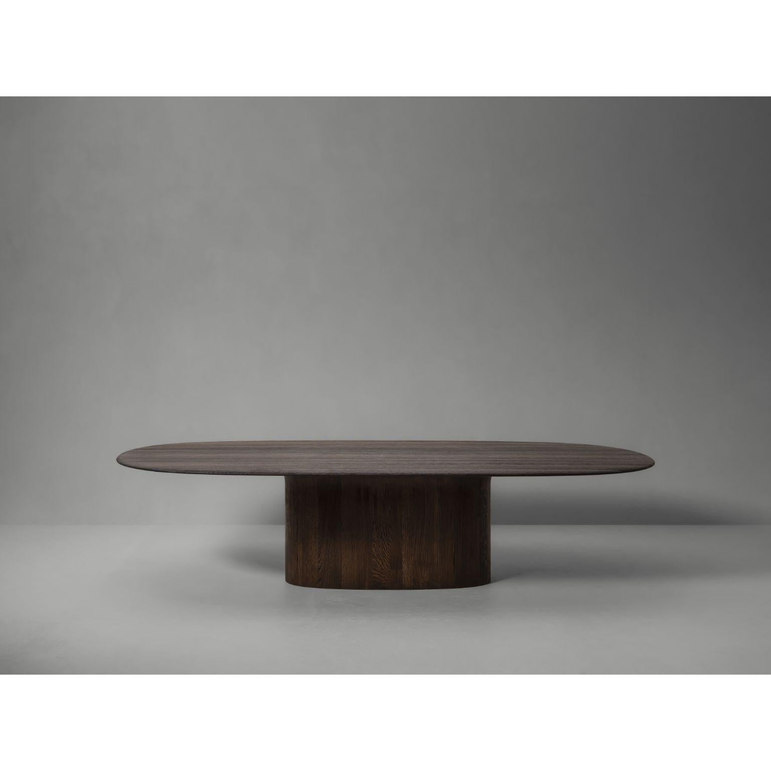 Anvil Semi-Oval Dinning Table by Van Rossum
Dimensions: D 240 x W 150 x H 72.5 cm
Materials: Walnut

A dining table with an elegantly contoured tabletop that narrows as it reaches the edge. Available in French oak or walnut, and with a round,
