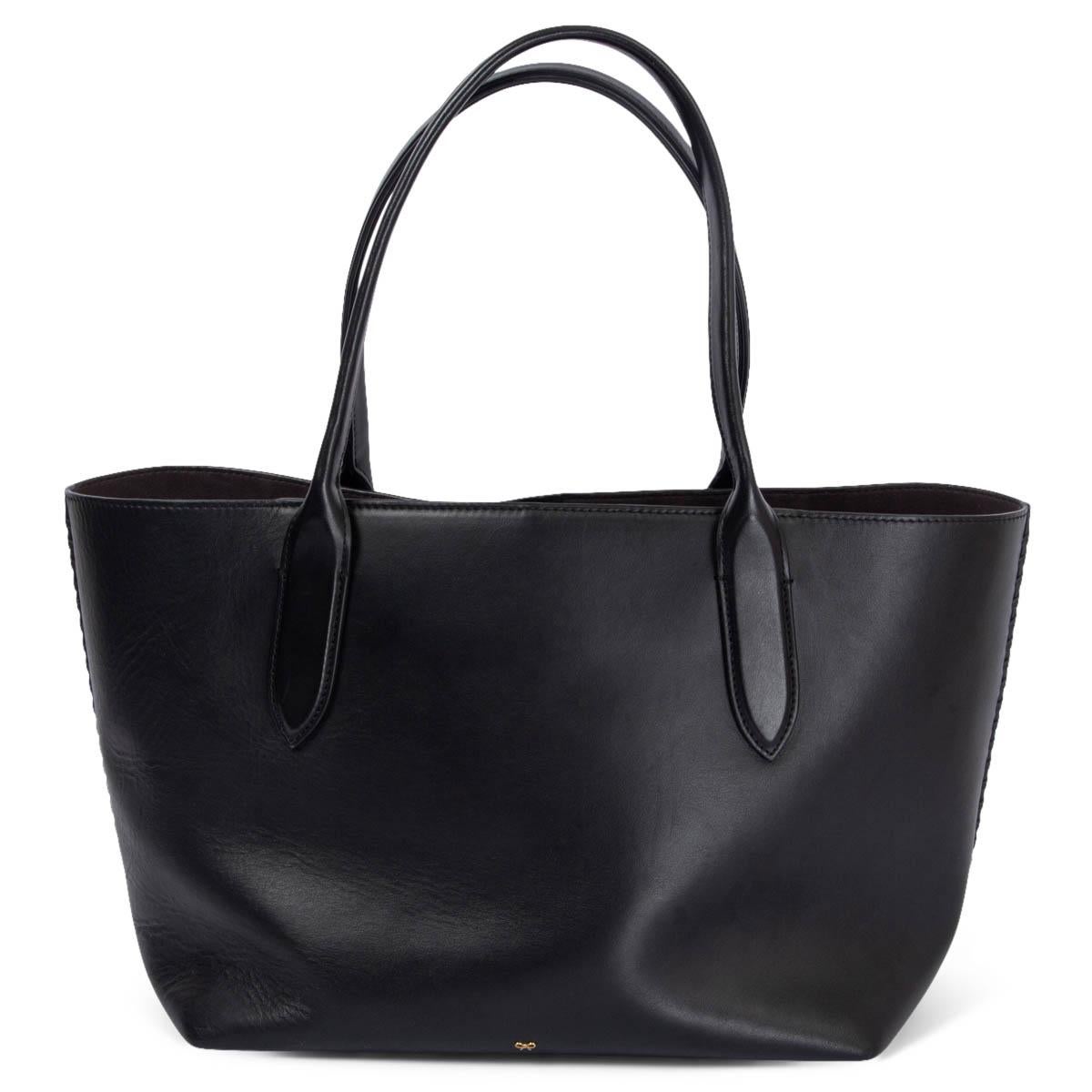 100% authentic Anya Hindmarch tote bag in smooth black calfskin with signature braided bow detail in the middle. Unlined with one sit pocket. Has been carried and shows some soft wear to the corners. 

Measurements
Height	26cm (10.1in)
Width	32cm