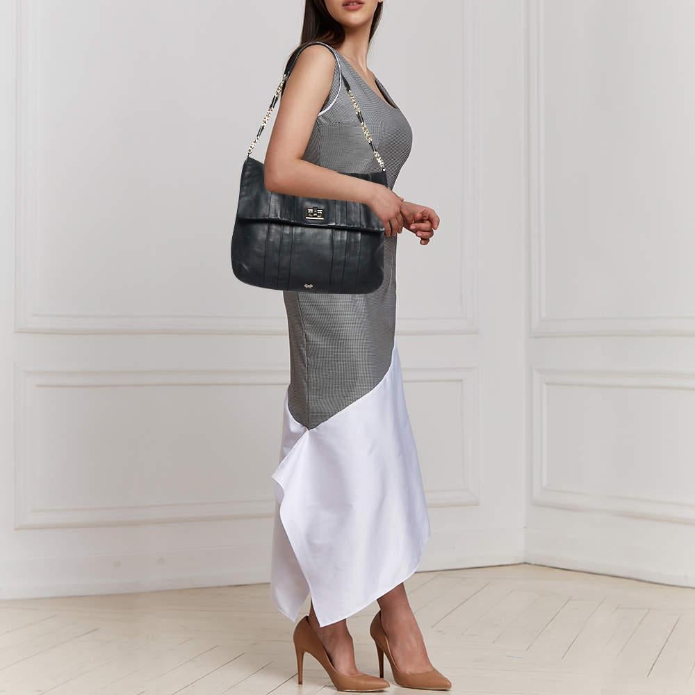 Elevate your style with this gorgeous hobo by Anya Hindmarch. Crafted from black leather the bag features gold tone hardware the logo on the flap and a well sized fabric interior. It is complete with a single handle.