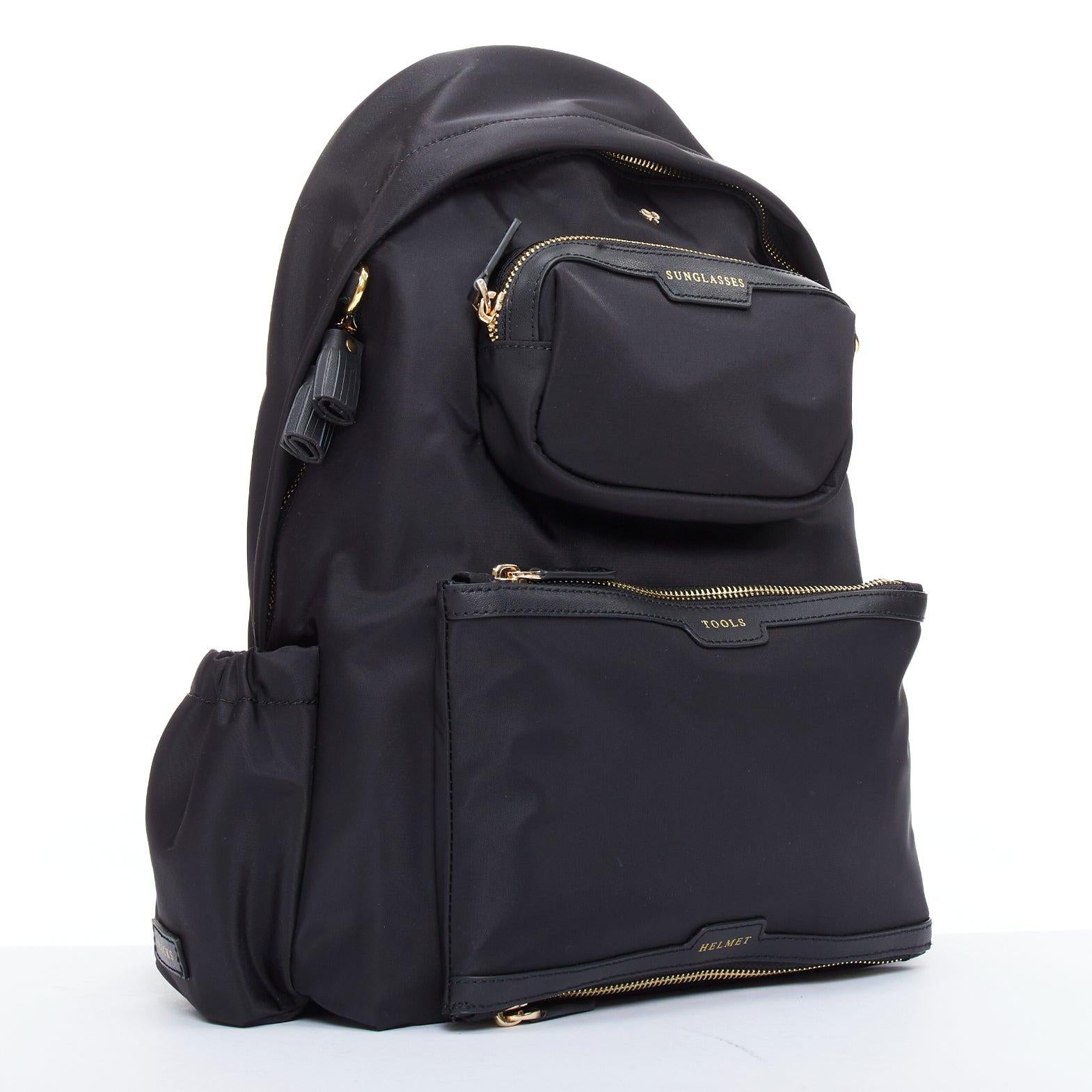 ANYA HINDMARCH Cycling black leather trim multi pocket shell backpack bag
Reference: LAYU/A00063
Brand: Anya Hindmarch
Model: Cycling
Material: Fabric
Color: Black, Gold
Pattern: Solid
Closure: Zip
Lining: Black Fabric
Extra Details: Our recycled