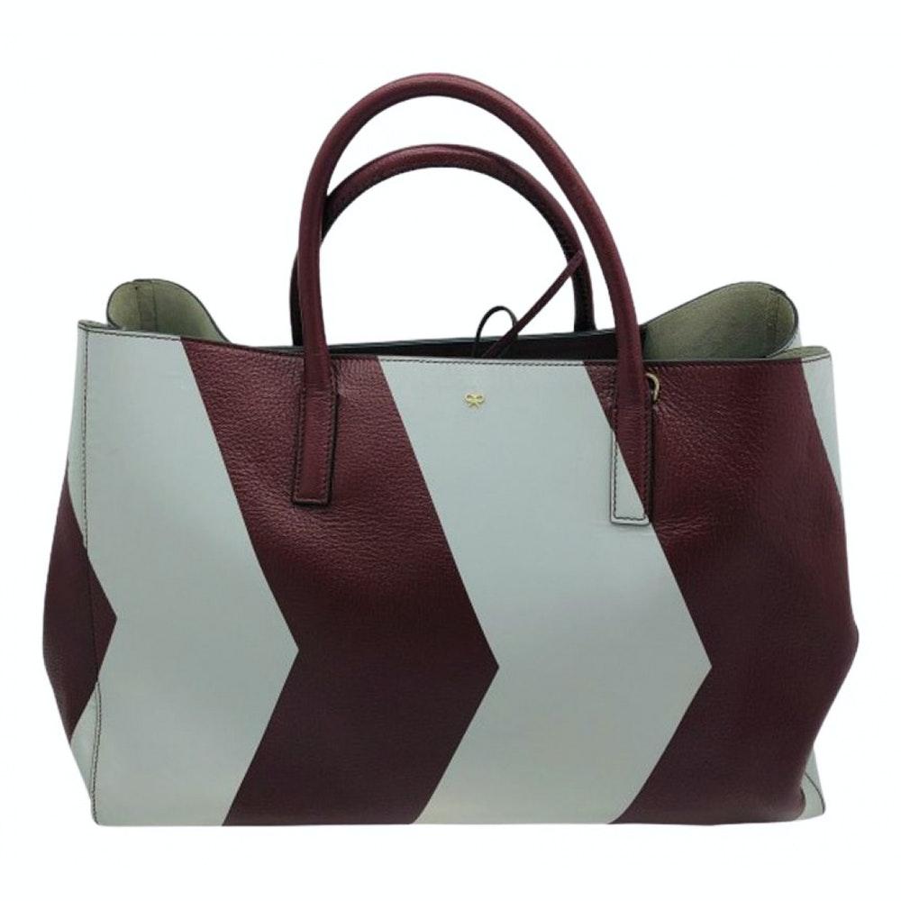 
BRAND	
Anya Hindmarch

FEATURES	
Feet protect bottom of bag, Inside: grey suede lining; one pocket, Rolled top handles, Signature bow at top center, Snap-button sides, Tie Closure

MATERIAL	
Leather

COLOUR	
Burgundy,