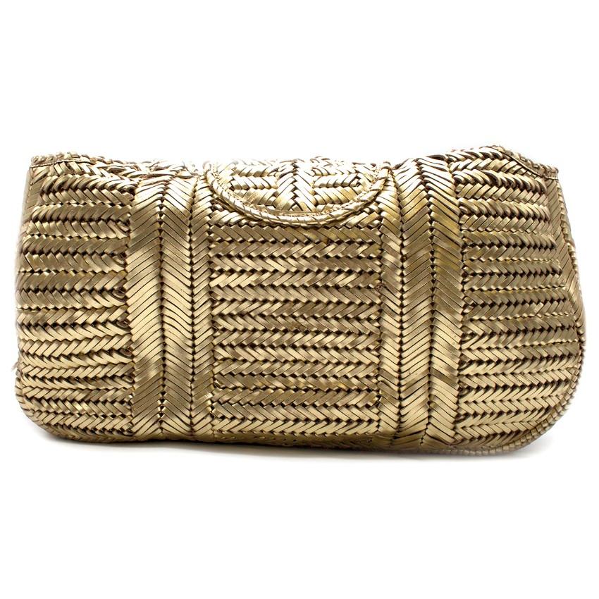 Anya Hindmarch Gold Woven-Leather Bag

-Gold woven shoulder bag
-Flap with tassel and woven bow
-Two top handles
-One interior pocket with two slots and one smaller zipped pockets

Please note, these items are pre-owned and may show signs of being