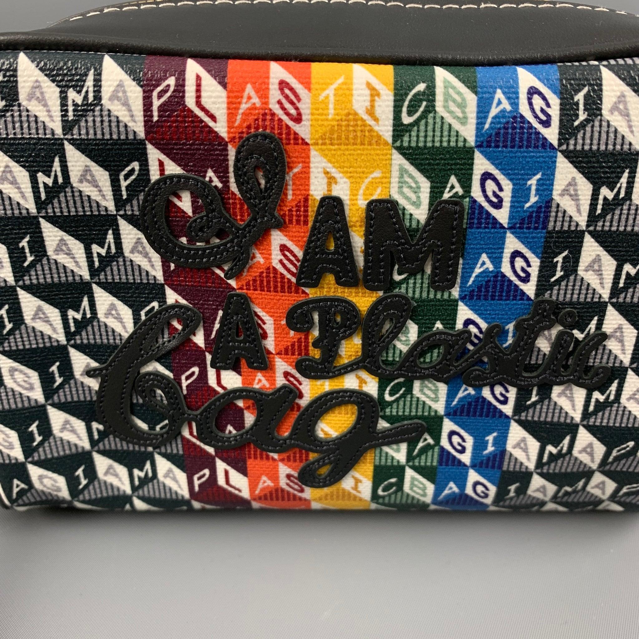 ANYA HINDMARCH handbag comes in a grey multi-color canvas material featuring a I'M A PLASTIC BAG applique on top, and zipper closure. Made in Italy.Excellent Pre-Owned Condition. 

Measurements: 
  Length: 7.25 inches Width: 2.5 inches Height: 5