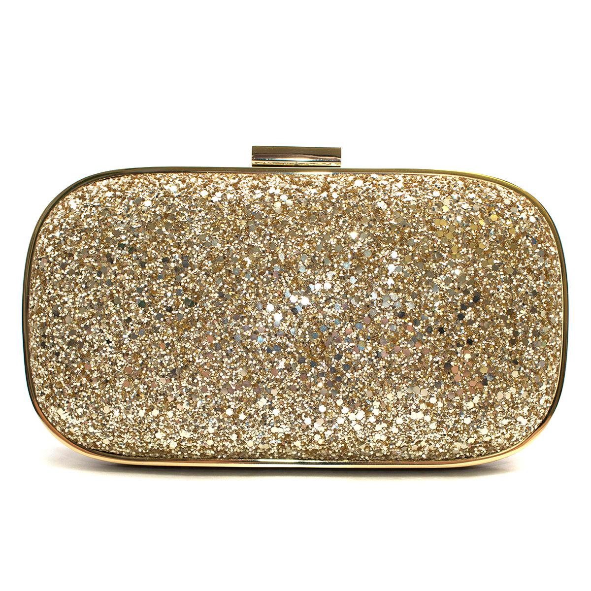 Anya Hindmarch Marano Gold Glitter Clutch

- Gold pale clutch
- Hard fram
- Metal hardware 
- Nude leather lining 
- Small slip pocket 
- Click closure

This item comes with original box. 

Please note, these items are pre-owned and may show some