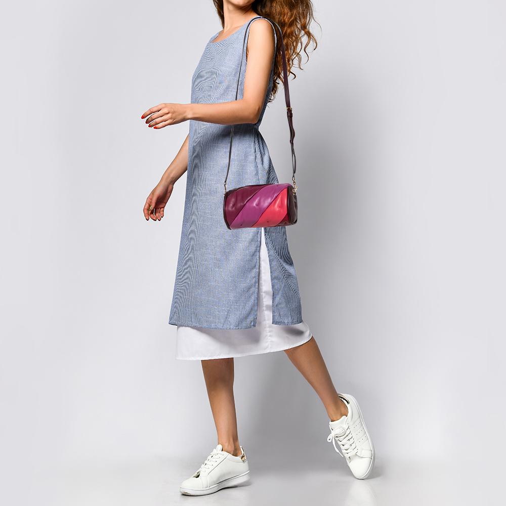 Designed to be durable, this Chubby Barrel crossbody bag from Anya Hindmarch is a prized buy. Comfortable and easy to carry, this leather creation comes in multiple hues with the brand detail on the top. It has a shoulder strap and an interior lined