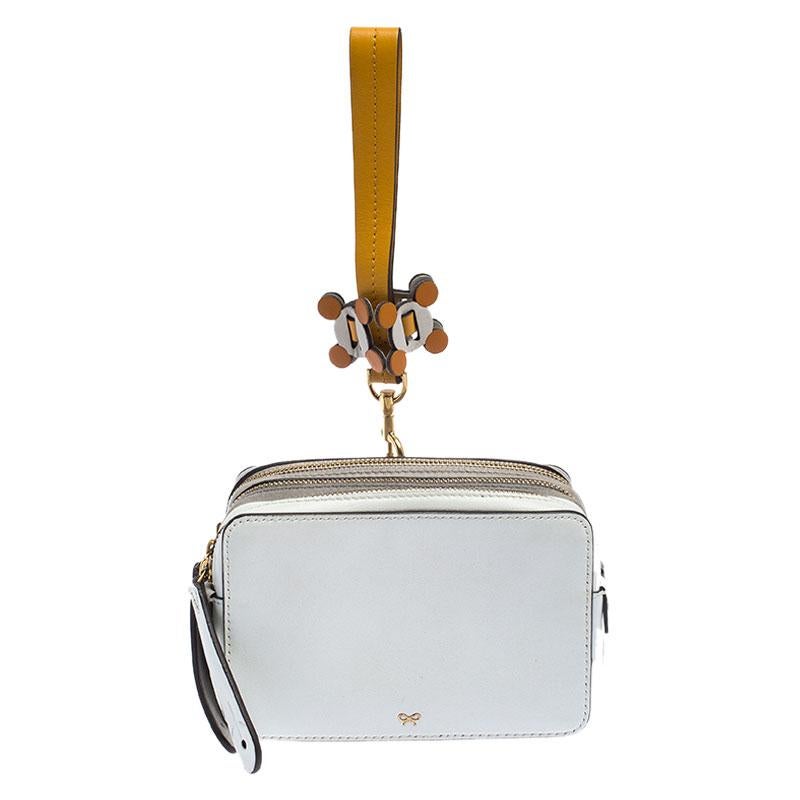 Carry your essentials in style with this clutch from Anya Hindmarch. Crafted from leather the clutch has multiple compartments lined with suede. The clutch will easily fit all your little essentials and can be carried using the wristlet.

Includes:
