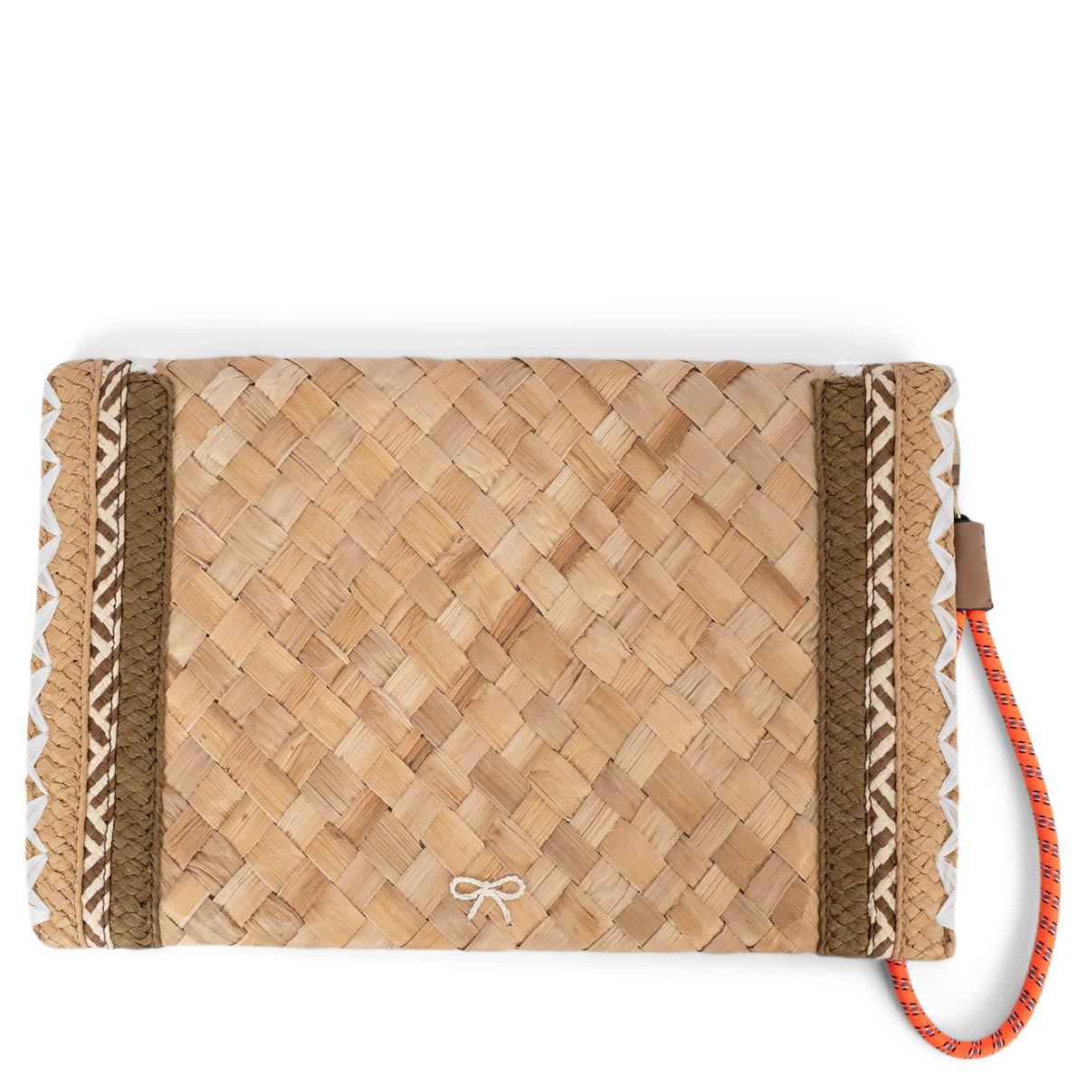 100% authentic Anya Hindmarch Smiley clutch in beige raffia with details in white, brown and neon orange. The design opens with a magnetic button and is lined in beige logo nylon. Comes with detachable handle. Has been carried and is in excellent