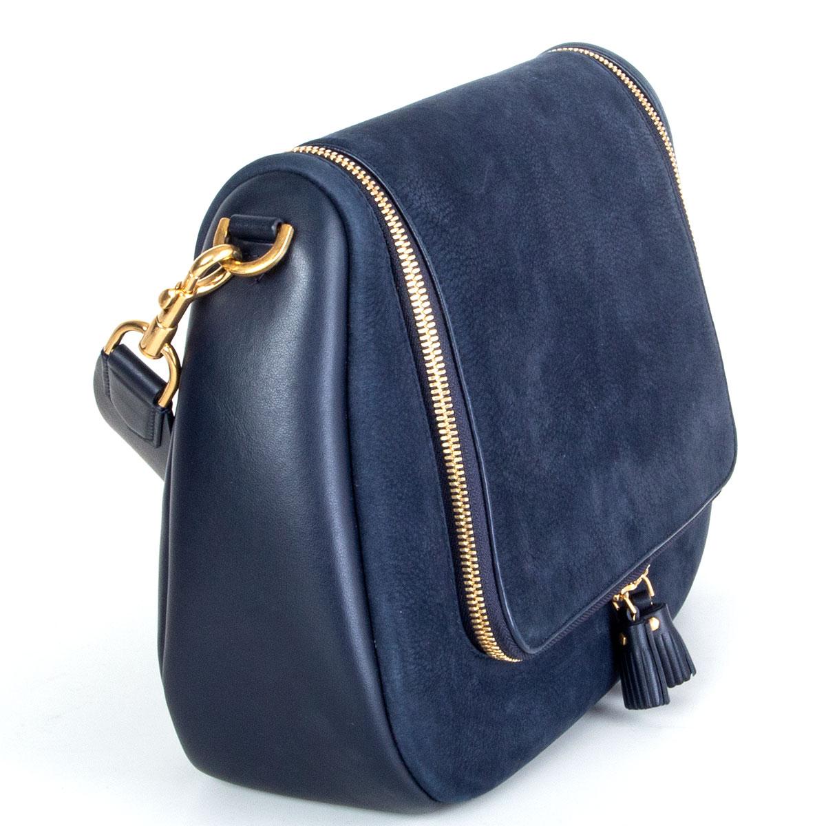 100% authentic Anya Hindmarch 'Maxi Vere Satchel' bag in navy nubuck with a detachable handle and side pannels in calfskin. Opens with a double zipper flap. Lined in petrol calfskin and light taupe suede with one open pocket against the back. Under