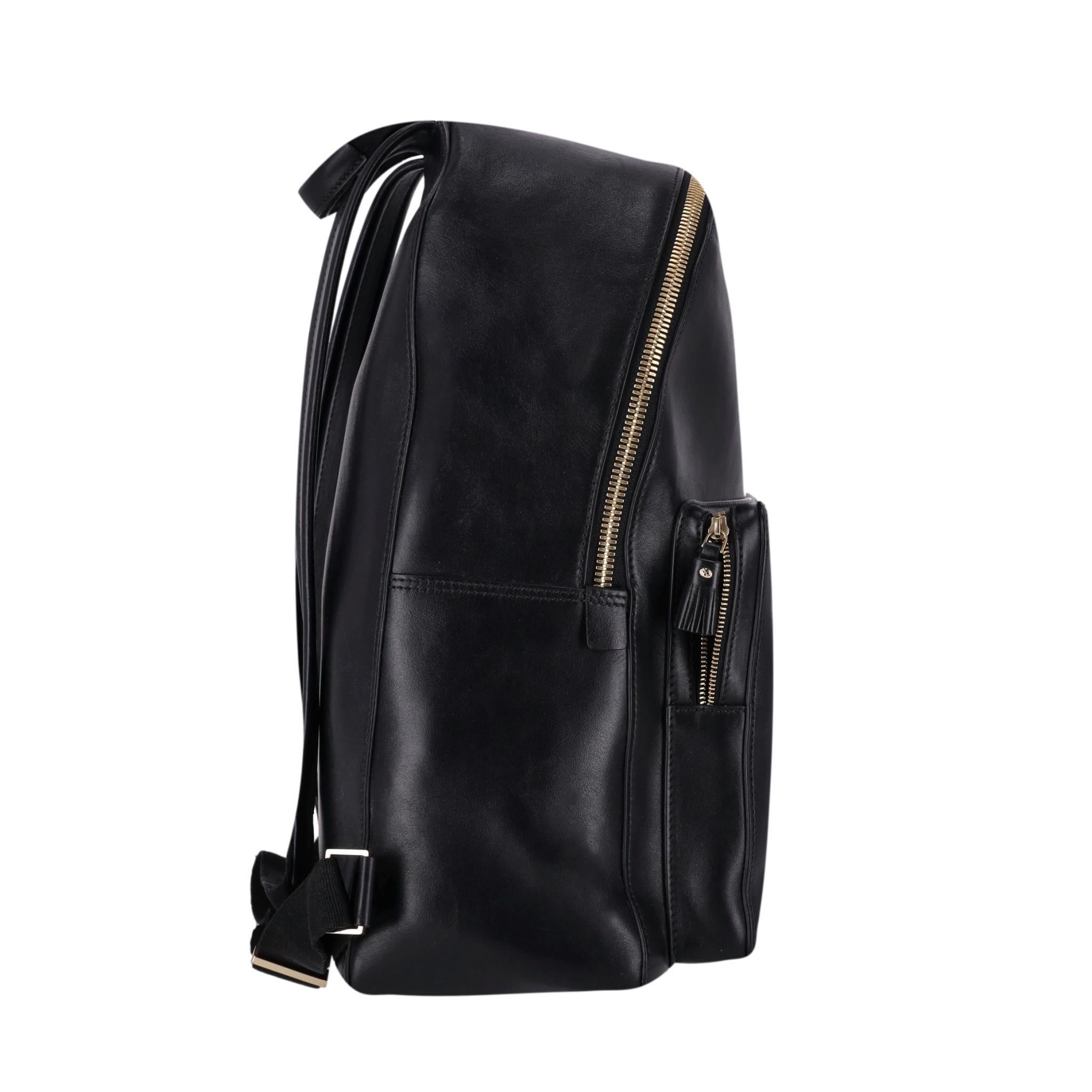 Anya Hindmarch Smiley Face Backpack 

Black leather with perforated 'smiley face'' to the front. Gold mini metal 

trim, hardware and zippers.

Size - Height 36, Width 30cm,  Depth 13

Condition- Good/Very Good (Scratches to leather)

Composition -