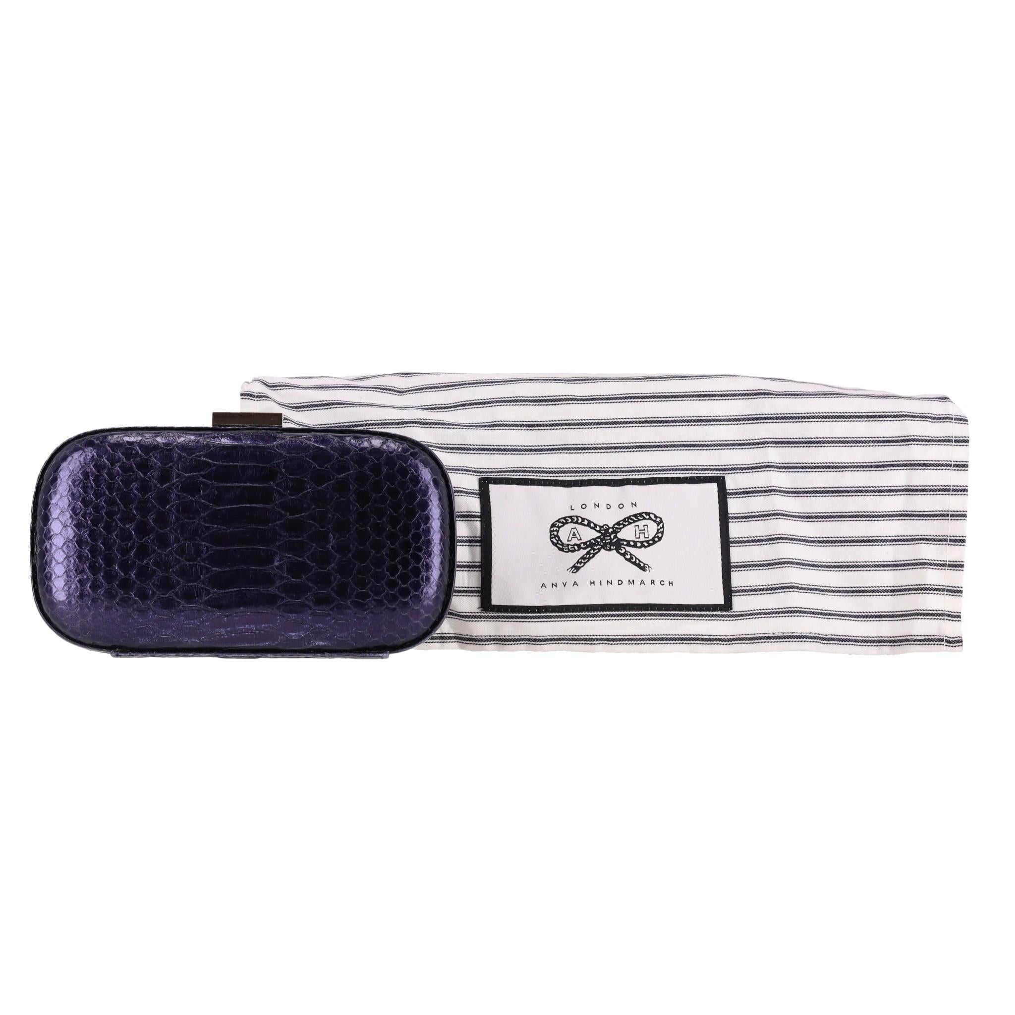 Anya Hindmarch Snake-Embossed Leather Clutch Bag

Metallic navy clutch bag crafted from snake-embossed leather.

Detailed with gold buckle with signature bow logo engravement.

Featuring suede interior with branded leather patch and slip