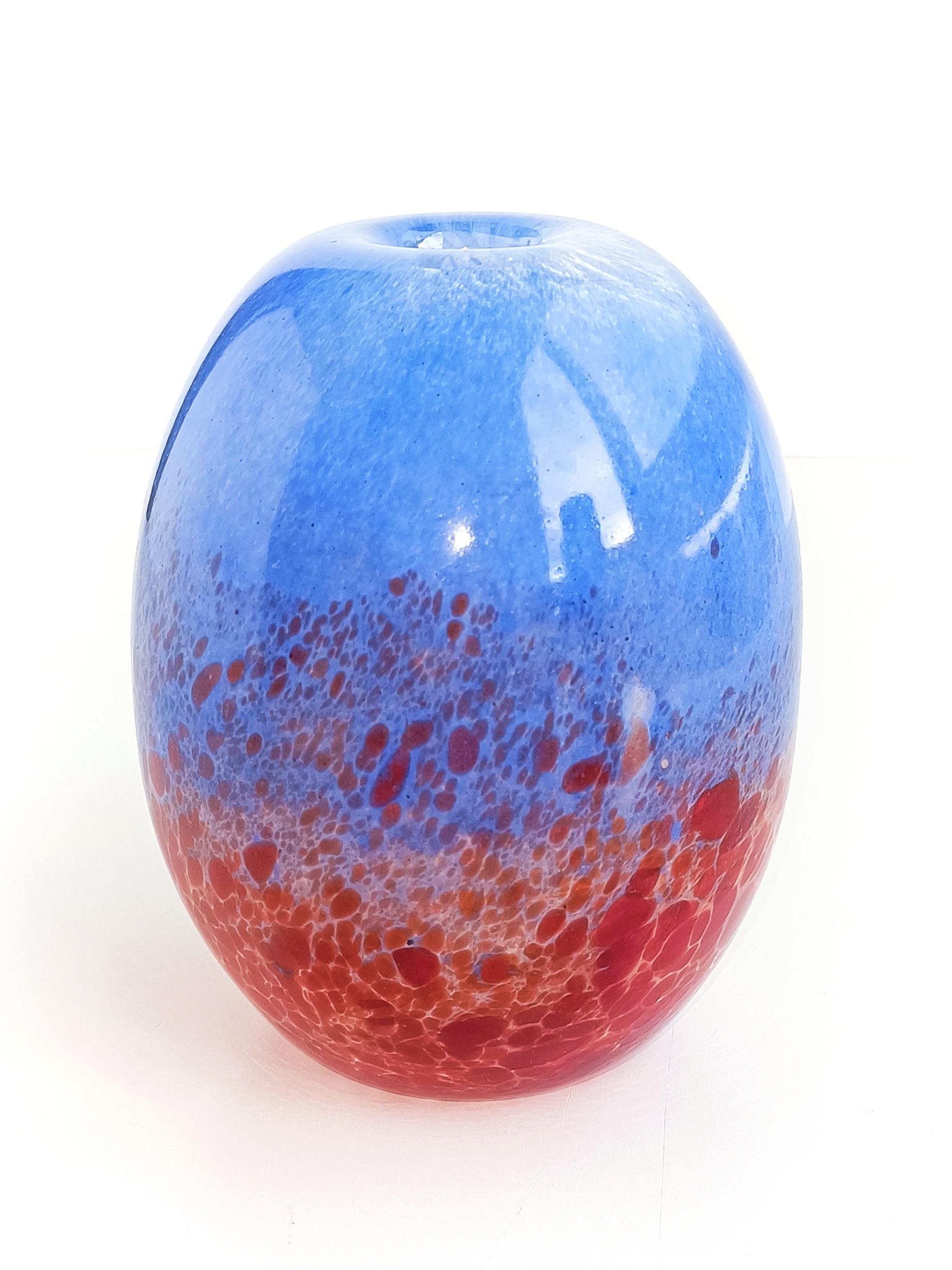 Murano glass vase attributed to Venice glass artist Anzolo Fuga for A.Ve.M. Handcrafted in the Murano island near Venice, Italy, circa the 1950s.

It is spectacular in the hand - the way the glass is worked along the ovoid shape blending the red