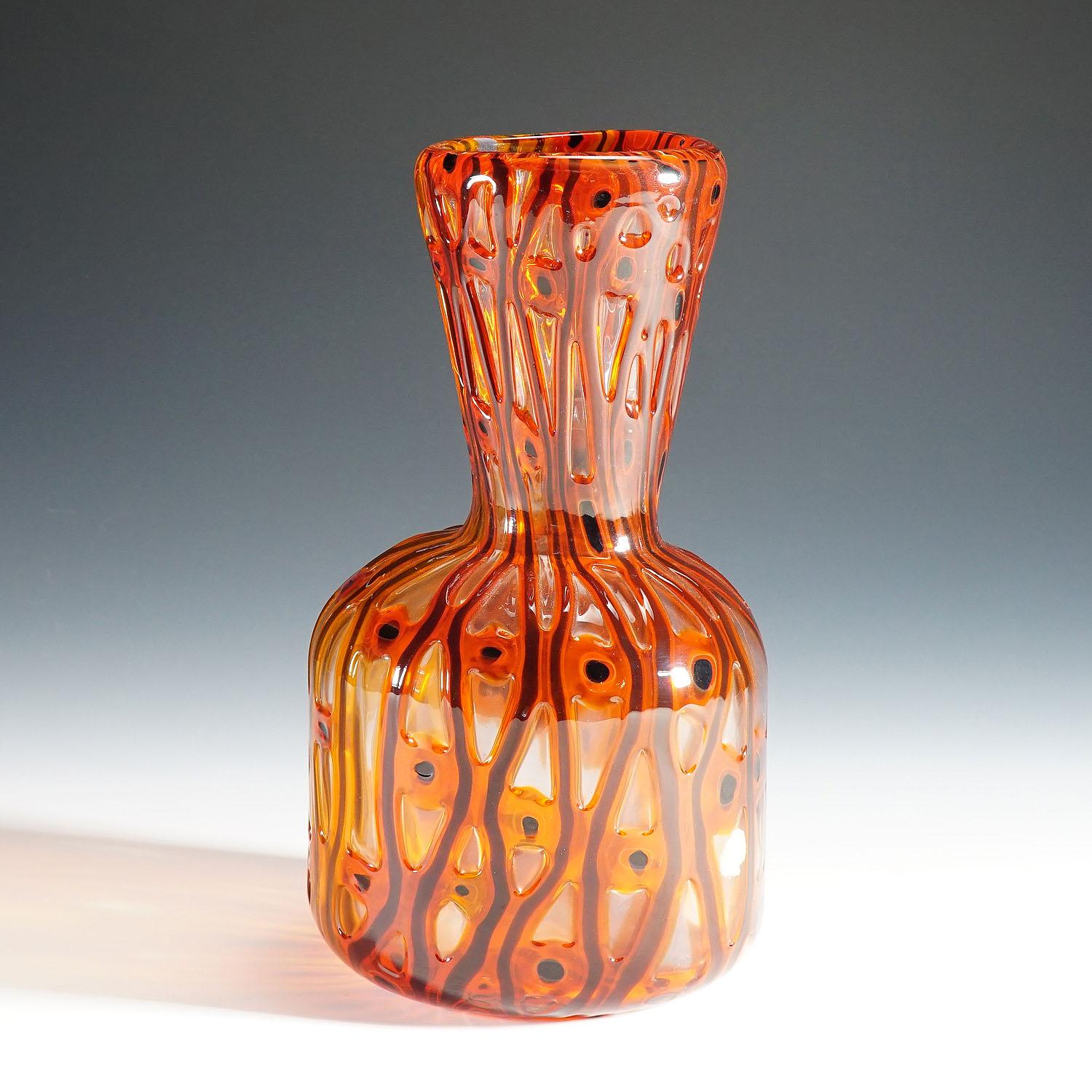 A large venetian glass vase 'transennati' manufactured by A.Ve.M. and designed by anzolo fuga in the 1960s. thick clear glass decorated with orange-red murrine and 'a canne' bands.
Lit.:
rosa barovier mentasti, anzolo fuga, new york 2005, page
