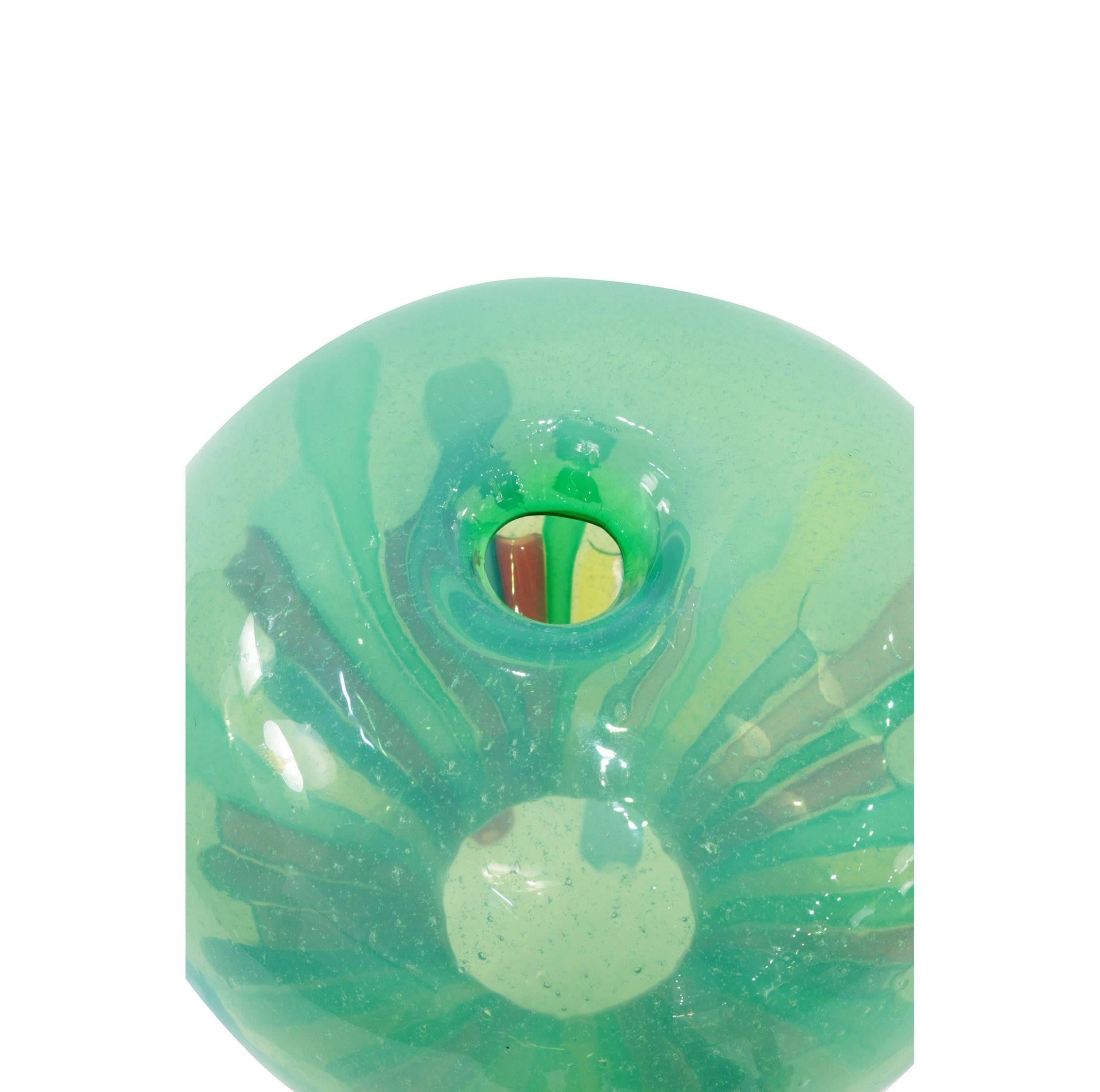 Large handblown green hourglass vase with applied multi-color rods designed by Anzolo Fuga for A.VE.M. (Arte Vetraria Muranese), Murano, Italy, circa 1960.

Rosa Barovier-Mentasti, Anzolo Fuga, Murano glass artist, Acanthus Press 2005, a general