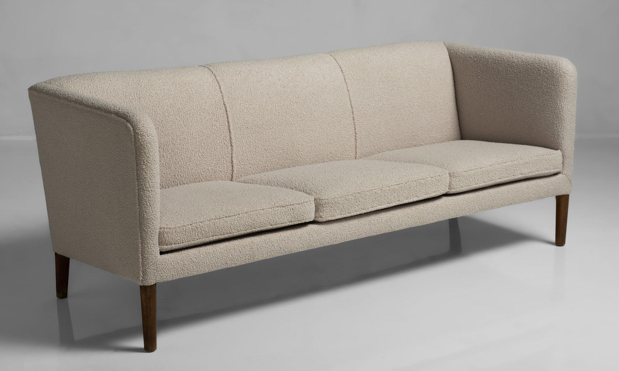 AP-18S sofa by Hans J. Wegner, Denmark, circa 1950.

Three-seat sofa newly upholstered in beige wool on solid oak legs. Manufactured by AP Stolen.