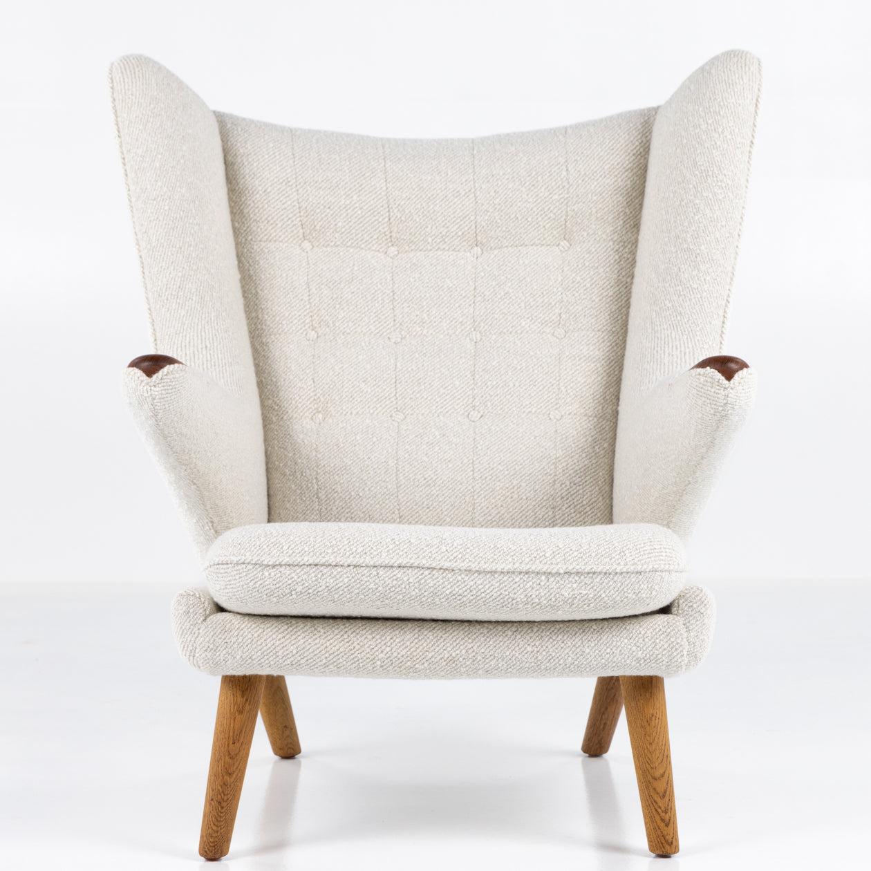 AP 19 - Reupholstered Papa Bear chair with matching stool in light textile (A Joy by Dedar, colour 002 Natural)

ABOUT THE FURNITURE: This is an original 'Papa Bear chair' by Hans J. Wegner, produced by the original manufacturer; AP Stolen. The