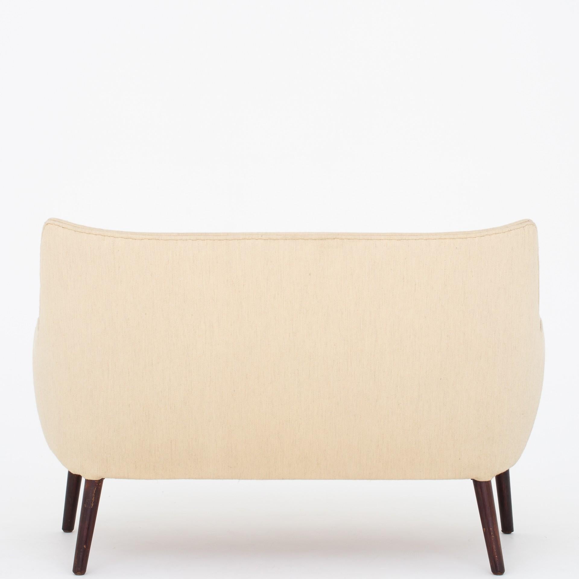 AP 20 - two-seat sofa in original light Savak-wool with legs and nails in stained beech. AP Stolen.