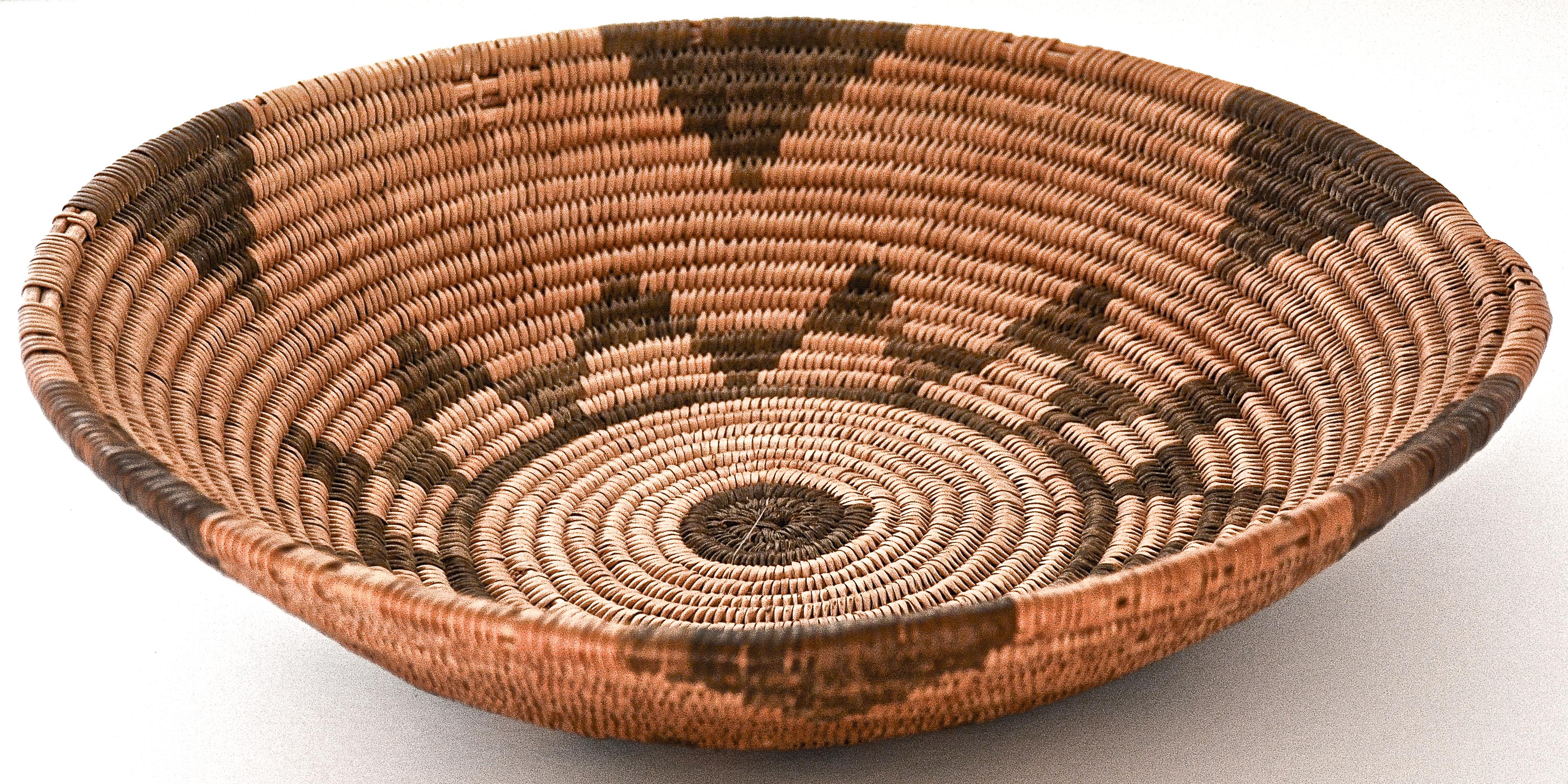 Apache basketry tray with 12 point star design
1900
Willow and Devil's claw
Measures: 2.50 inches Height. x 10 inches in Diameter

 An excellent example of a coiled Apache basketry tray dating from 1900.

The basket appears in very good