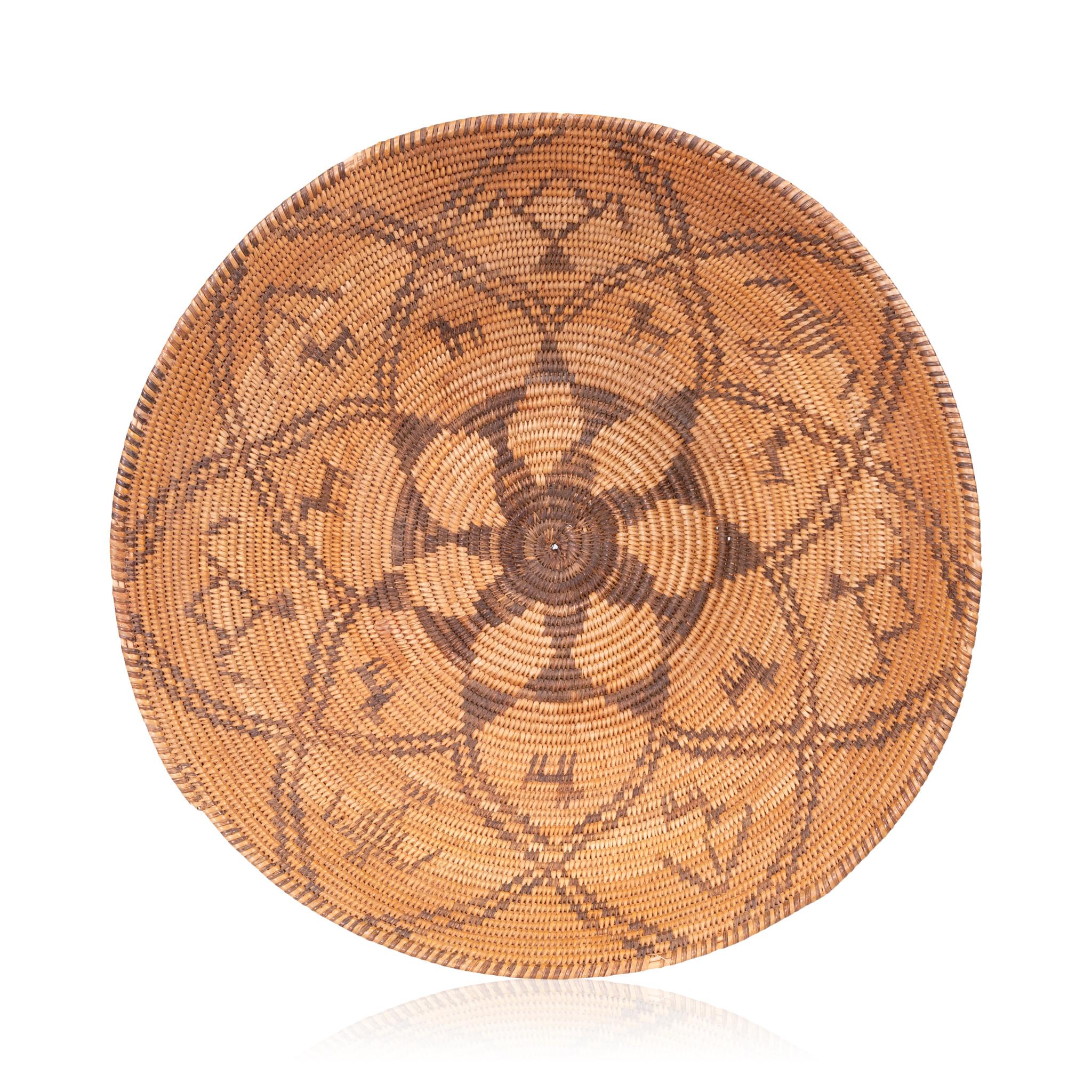 Finely woven pictorial apache basket with flower design, dogs, humanoids and geometrics.

Period: circa 1900
Origin: Apache, Arizona
Size: 4