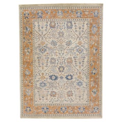 Tapis en laine beige et orange de la collection artisanale Apadana, fait à la main et à motifs floraux
