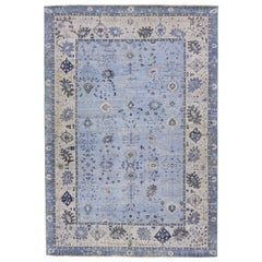 Tapis en laine indienne bleu clair Apadana's Artisan Collection fait à la main à motifs floraux
