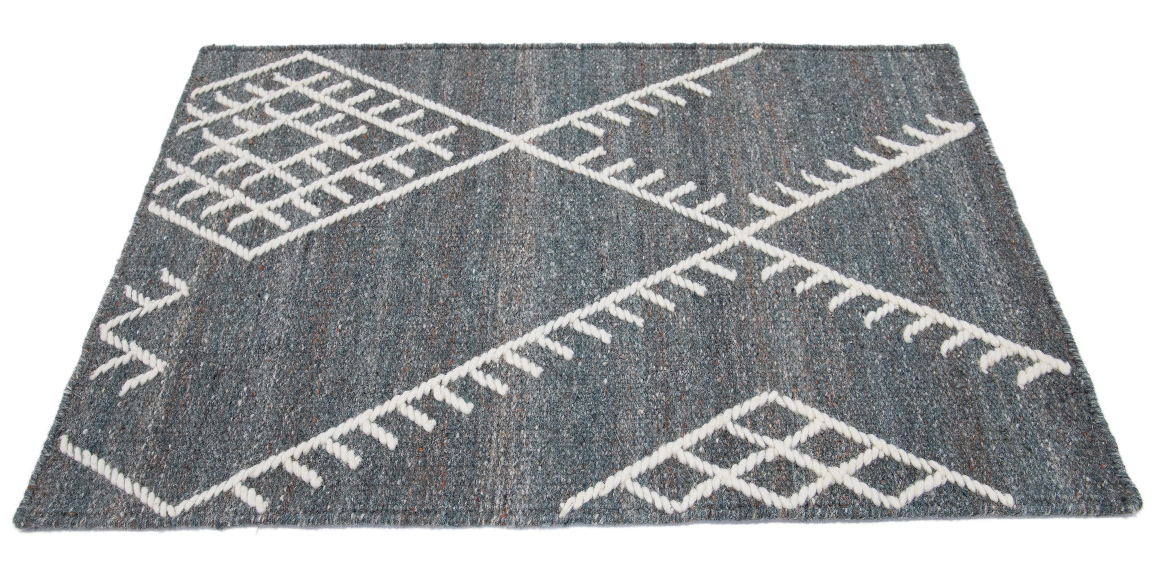 Apadana's Nantucket Collection wool custom rug. Custom sizes and colors made-to-order. 

Material: Wool 
Techniques: Flatweave
Style: Geometric-Coastal
Lead time: Approx. 15-16 wks available 
Colors: As shown, other custom colors are