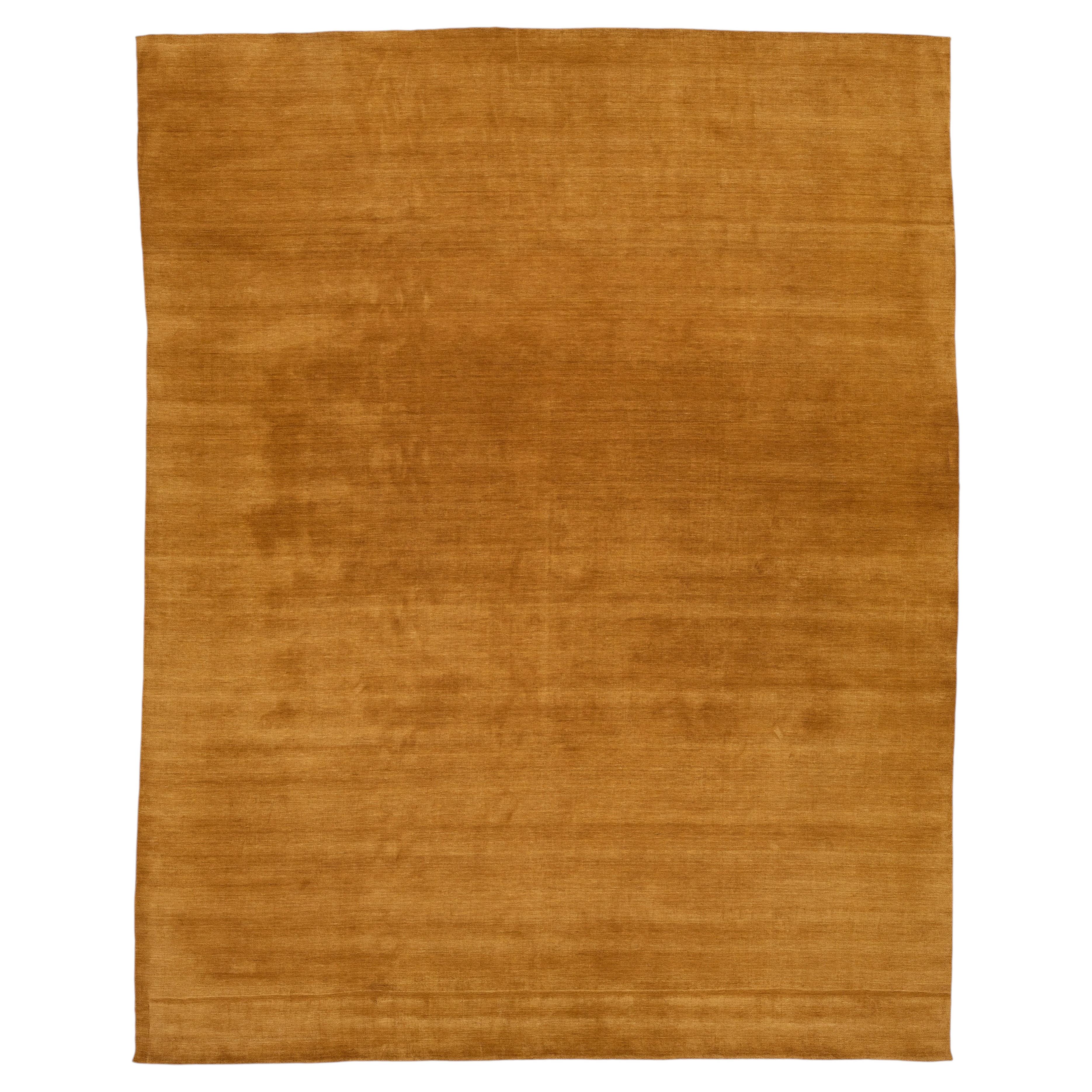 Apadana's Modern Gabbeh Hand-Loom Wool Area Rug In Earthy Yellow-Orange.