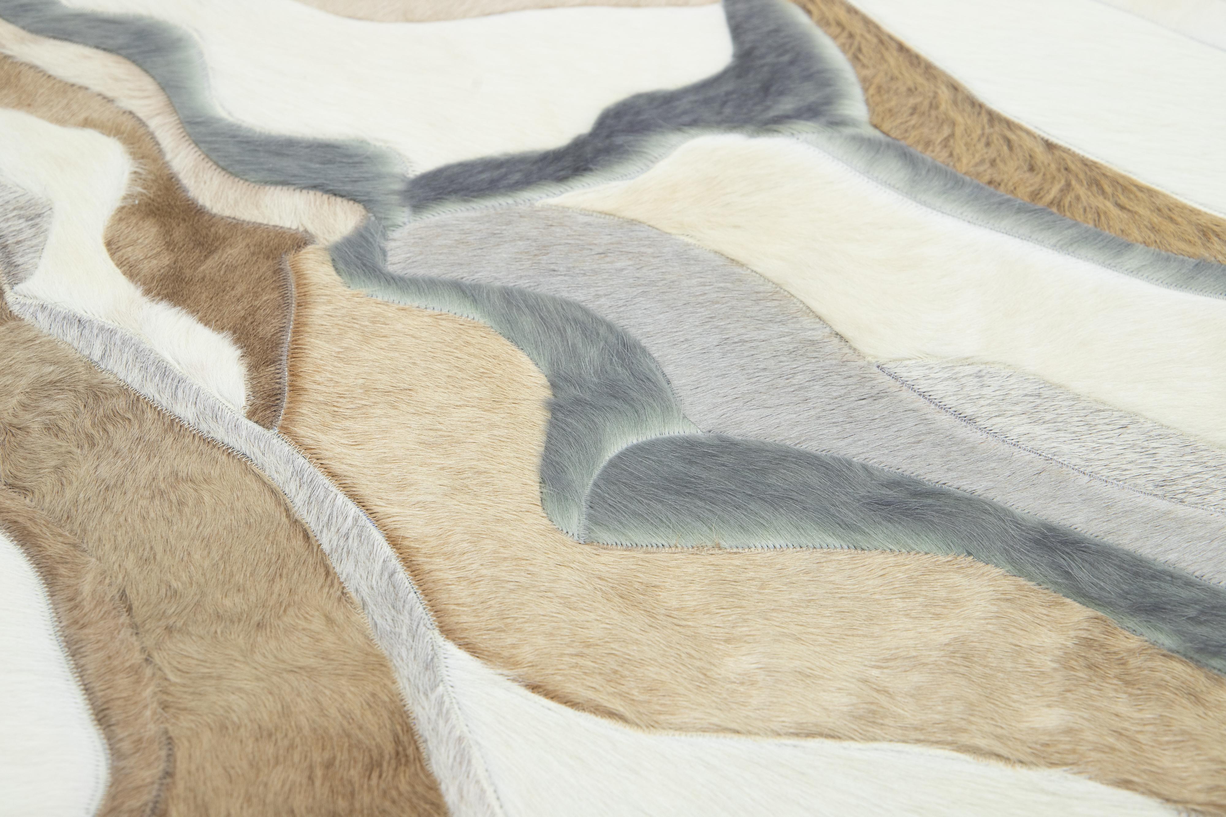 The Modern Genuine Cowhide Leather Custom Rug offers customizable options for size and color. Hand-crafted with Cowhide (Genuine Cowhide Leather), it exudes exceptional quality and durability. Sourced from Argentina, it has a 15-20 week lead